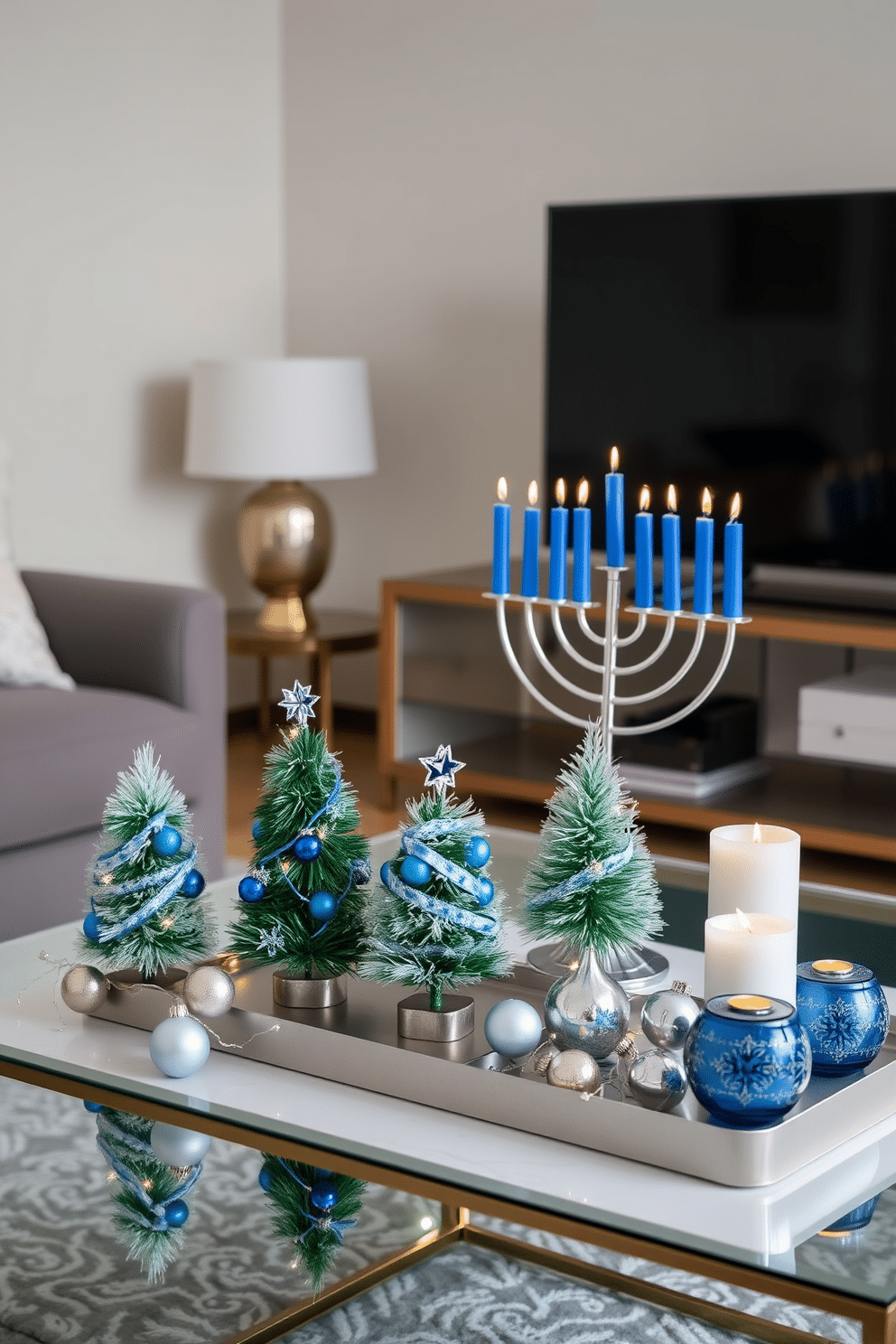 Miniature Christmas trees adorned with blue accents sit elegantly on a modern coffee table. The trees are surrounded by twinkling fairy lights and delicate silver ornaments, creating a festive atmosphere in a cozy living room. For Hanukkah decorating ideas in an apartment, a beautifully arranged menorah takes center stage on a stylish side table. Surrounding it are blue and silver accents, such as decorative dreidels and candles, enhancing the festive spirit while maintaining a chic aesthetic.