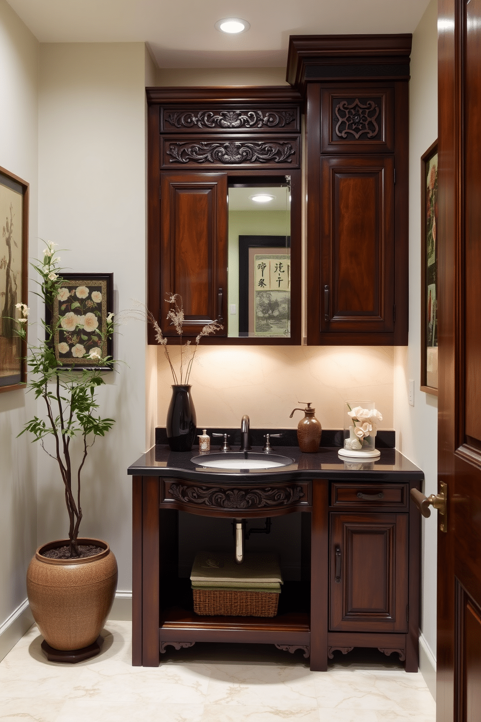 Traditional wooden cabinetry with rich finishes creates an inviting and elegant atmosphere. The intricate carvings and deep hues of the wood contrast beautifully with the delicate Asian-inspired decor elements. Soft lighting illuminates the space, highlighting the ornate details of the cabinetry. Decorative accents, such as a bamboo plant and silk wall hangings, enhance the serene ambiance of the powder room.