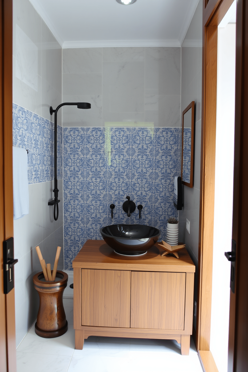 A serene Asian powder room featuring intricate tile work in the shower area, showcasing delicate patterns in shades of blue and white. The space includes a sleek wooden vanity with a vessel sink, complemented by bamboo accents and soft, ambient lighting.