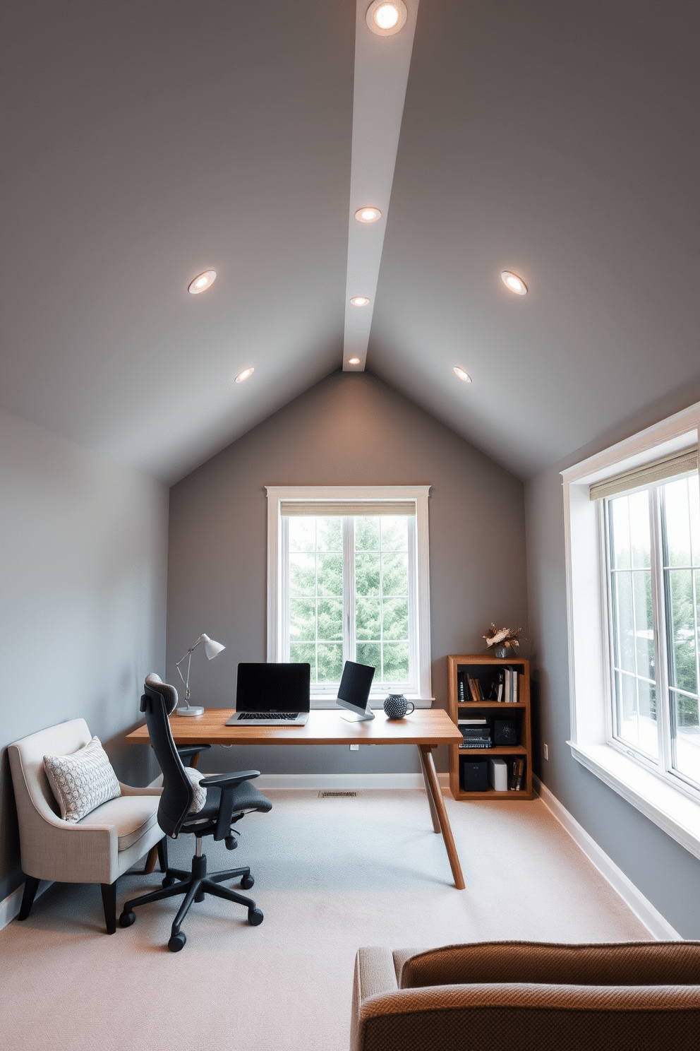 A sleek attic office space featuring recessed lighting that creates a modern ambiance. The walls are painted in a soft gray, complemented by a minimalist wooden desk and an ergonomic chair, with large windows allowing natural light to flood the room. The ceiling is adorned with recessed lights that highlight the room's clean lines and contemporary decor. A cozy reading nook with a stylish armchair and a small bookshelf adds warmth to the professional environment.