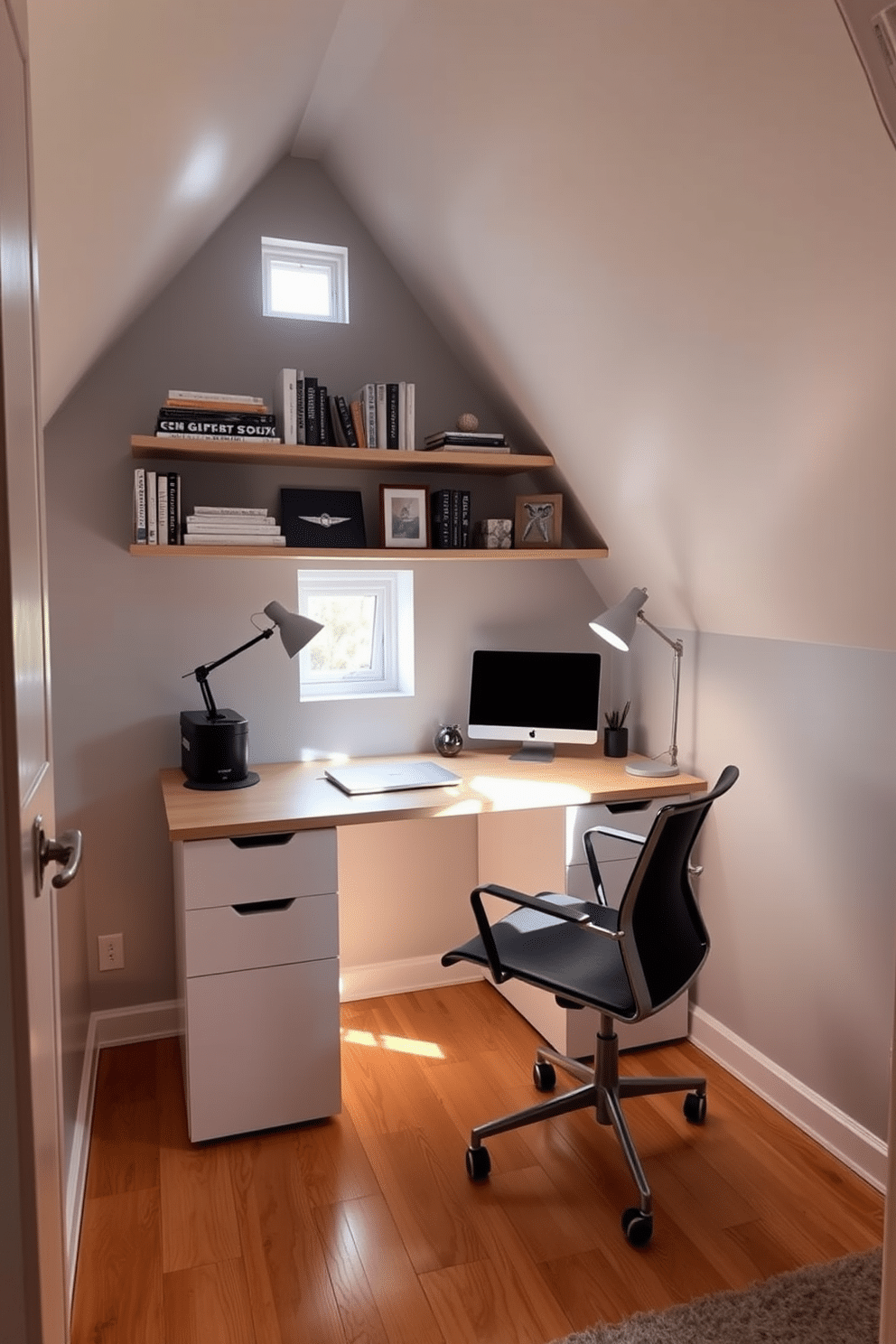 A compact workstation nestled in the corner of an attic office features a sleek, modern desk with clean lines and a minimalist aesthetic. Natural light floods the space through a small window, illuminating the soft gray walls and the warm wooden floor. Above the desk, a series of floating shelves display curated books and decorative items, adding personality to the workspace. A comfortable, ergonomic chair complements the setup, while a stylish desk lamp provides focused lighting for late-night projects.