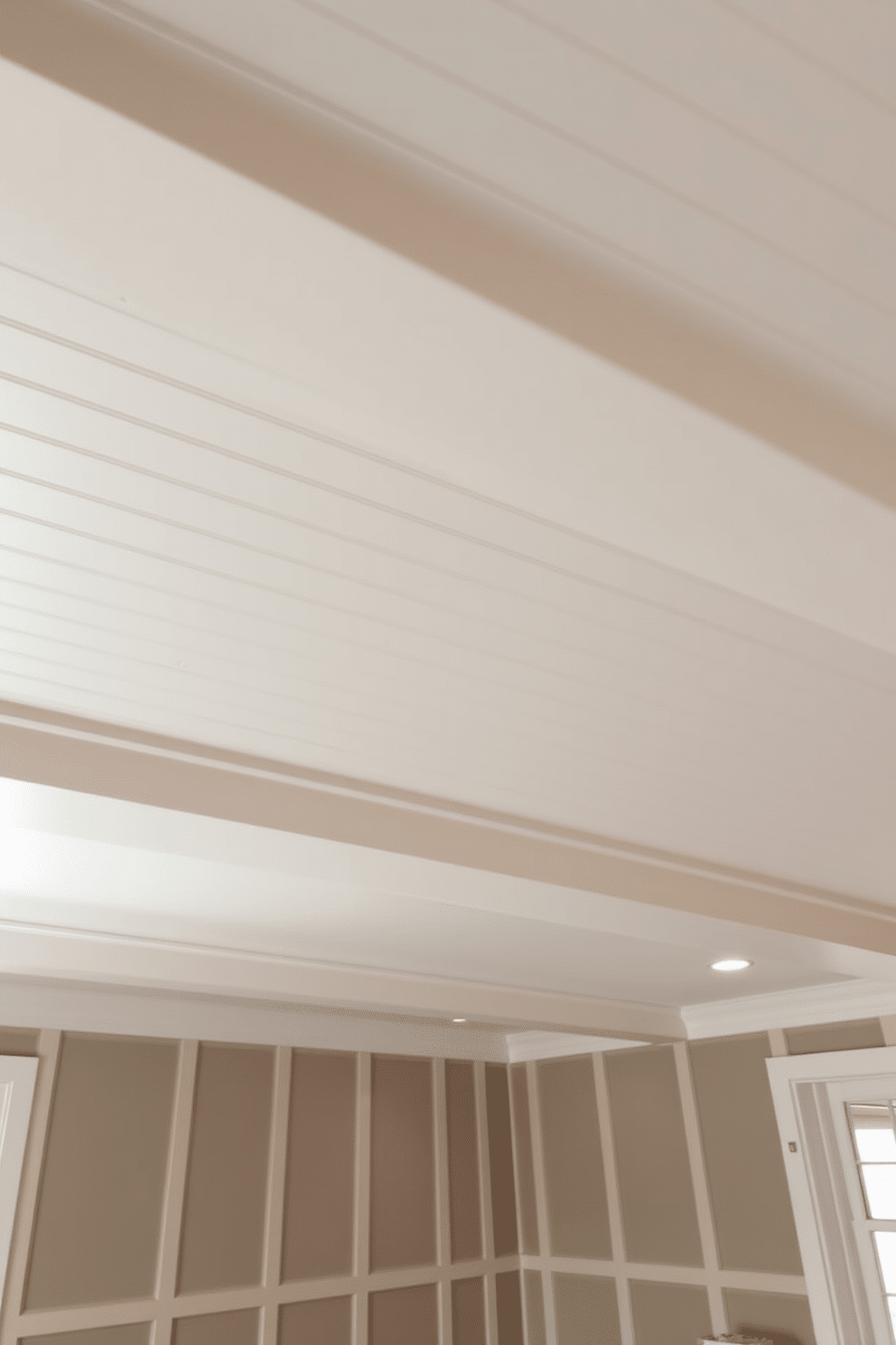 Beadboard ceiling for classic appeal. The room features a white beadboard ceiling that adds texture and charm, enhancing the overall aesthetic with its timeless design. Basement ceiling design ideas. Incorporate recessed lighting and painted beams to create an inviting atmosphere, while using a combination of drywall and wood paneling for a sophisticated finish.