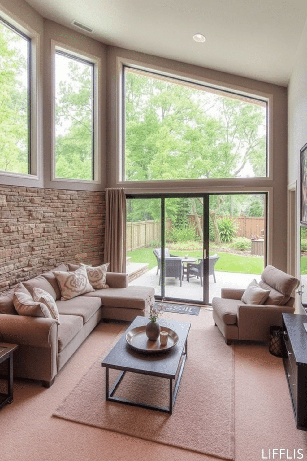 A spacious basement family room featuring large windows that create an indoor-outdoor flow, allowing natural light to flood the space. The room is designed with comfortable seating arrangements, including a plush sectional sofa and a cozy armchair, complemented by a modern coffee table. The decor incorporates earthy tones and textures, with a stone accent wall that adds warmth and character. A sliding glass door leads to an outdoor patio, seamlessly connecting the indoor space with the lush greenery outside.