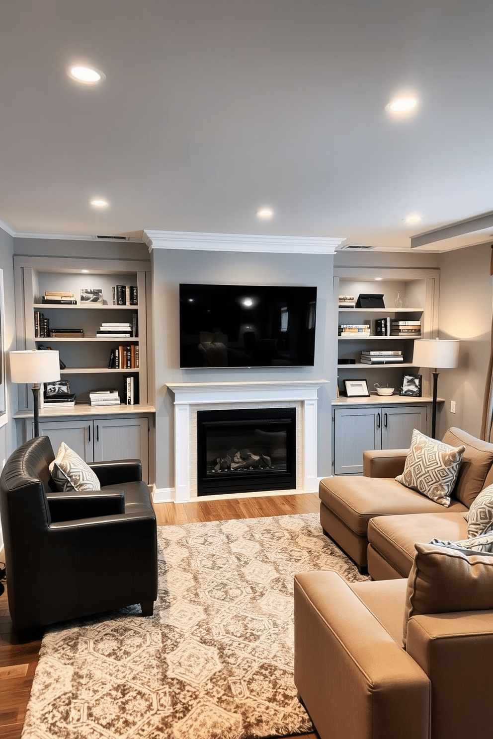 A cozy basement family room features a wall-mounted TV positioned above a sleek, modern fireplace. Built-in shelves flank the TV, showcasing books and decorative items, while a plush sectional sofa invites relaxation in warm, neutral tones. The walls are painted in a soft gray, creating a calming atmosphere, and the floor is adorned with a large, textured area rug for added comfort. Ambient lighting fixtures and strategically placed lamps enhance the inviting ambiance, making it the perfect space for family gatherings and entertainment.