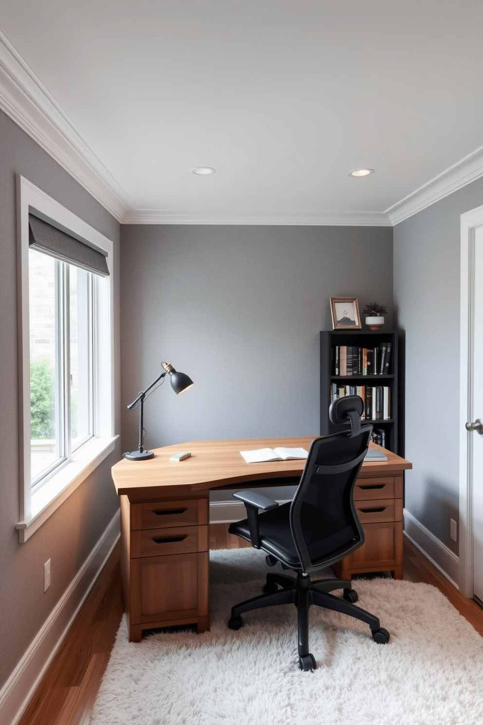 A serene basement home office designed for maximum tranquility. The walls are lined with soundproofing panels in soft gray, and a plush area rug adds warmth underfoot. A sleek wooden desk faces a large window, which is fitted with soundproof glass to minimize outside noise. A comfortable ergonomic chair complements the desk, and a small bookshelf filled with inspiring literature sits in the corner.