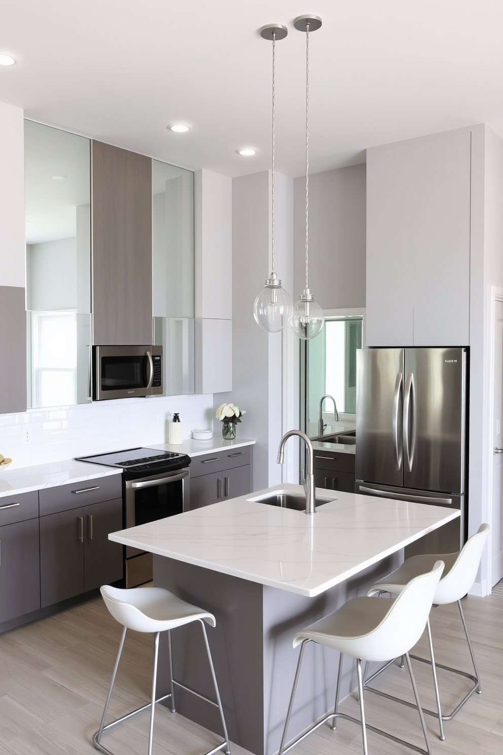 A modern basement kitchen featuring clever mirror placements that enhance the sense of space. The walls are painted in a light gray, and large mirrors are installed on one side to reflect light and create an airy atmosphere. The kitchen island boasts a sleek quartz countertop with bar stools that complement the overall design. Stainless steel appliances are seamlessly integrated, and pendant lights hang above the island, adding a touch of elegance.