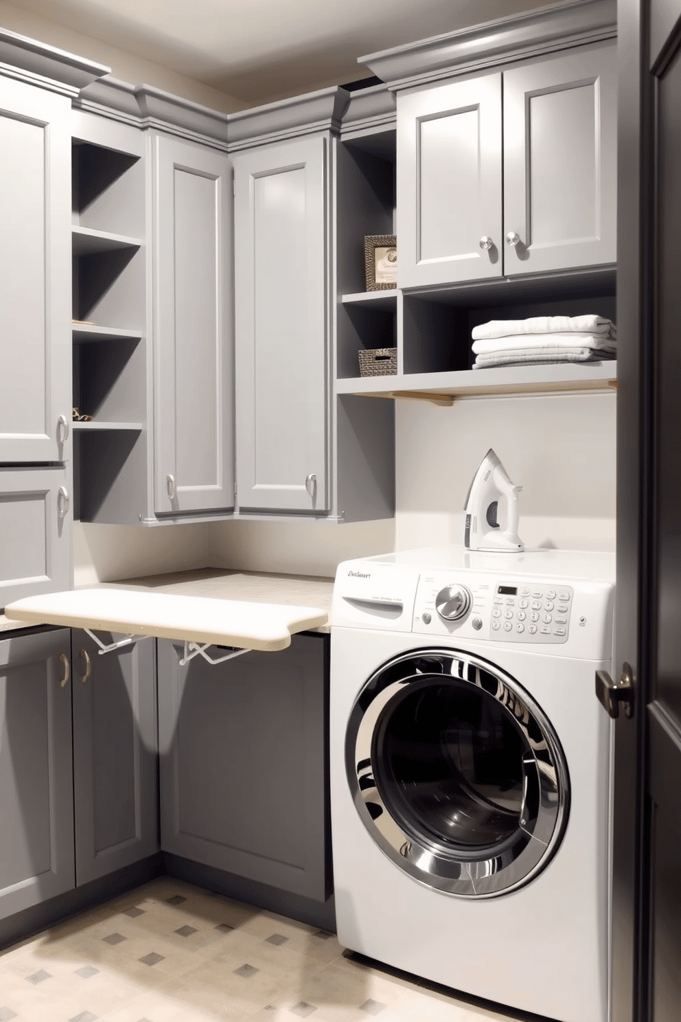 A functional basement laundry room features a built-in ironing board seamlessly integrated into the cabinetry for convenience. The space is designed with ample storage, including shelves and cabinets, in a soft gray palette that complements the bright white appliances.