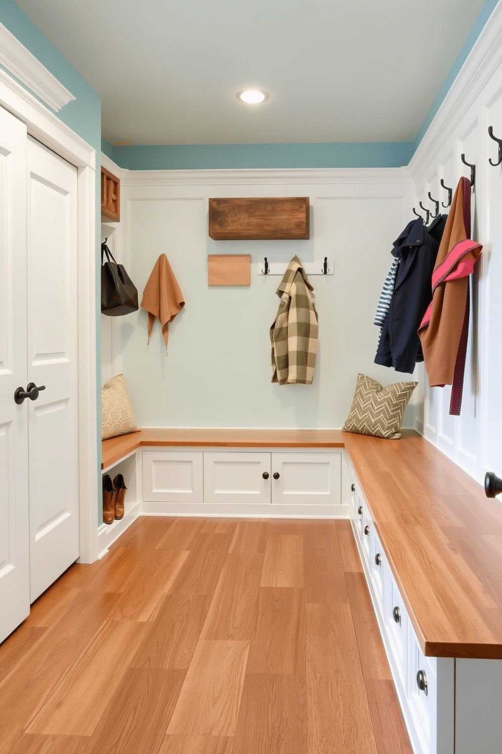 A functional mudroom in the basement featuring durable vinyl flooring for easy maintenance. The space is designed with built-in storage benches and hooks for coats, complemented by a bright, welcoming color palette.