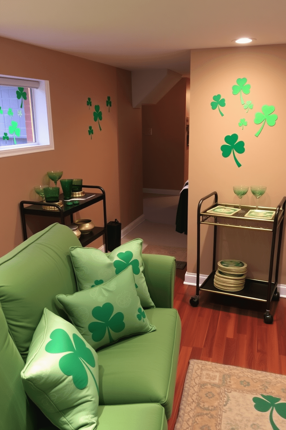 A cozy basement space adorned with festive Shamrock window clings that bring a touch of St. Patrick's Day cheer. The walls are painted a warm beige, and the floor features a rich, dark wood finish, creating an inviting atmosphere for gatherings. In one corner, a small bar cart is decorated with green and gold accents, including shamrock-shaped coasters and themed glassware. Soft, ambient lighting illuminates the space, highlighting a plush green sofa adorned with patterned throw pillows featuring shamrocks and Celtic designs.