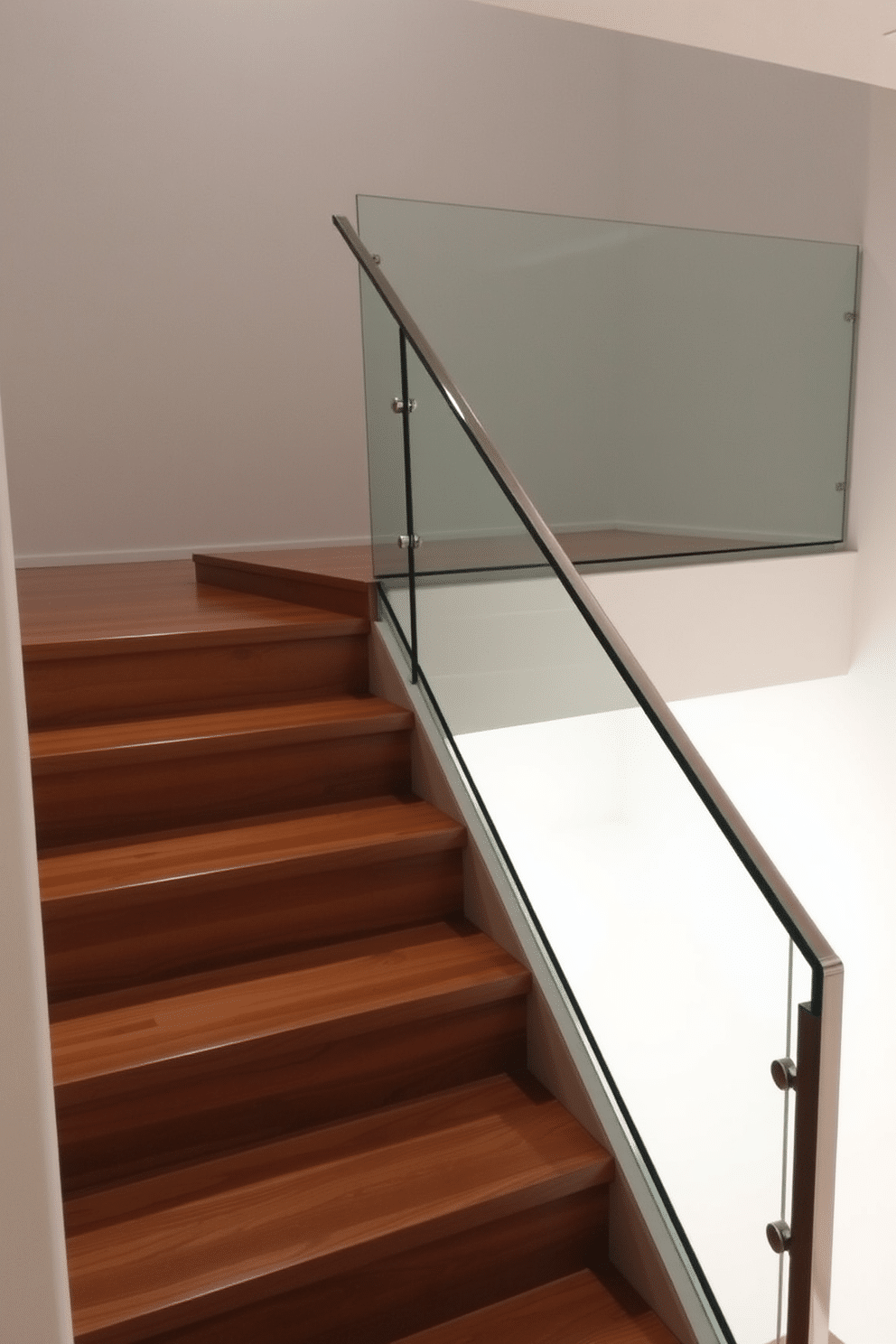 A modern basement staircase features a sleek glass railing that offers an unobstructed view of the space. The wooden treads are rich in color and texture, providing a warm contrast to the transparency of the glass. The staircase is illuminated by recessed lighting, highlighting the elegant lines of the design. A minimalist aesthetic is achieved through the use of clean angles and a harmonious blend of materials.