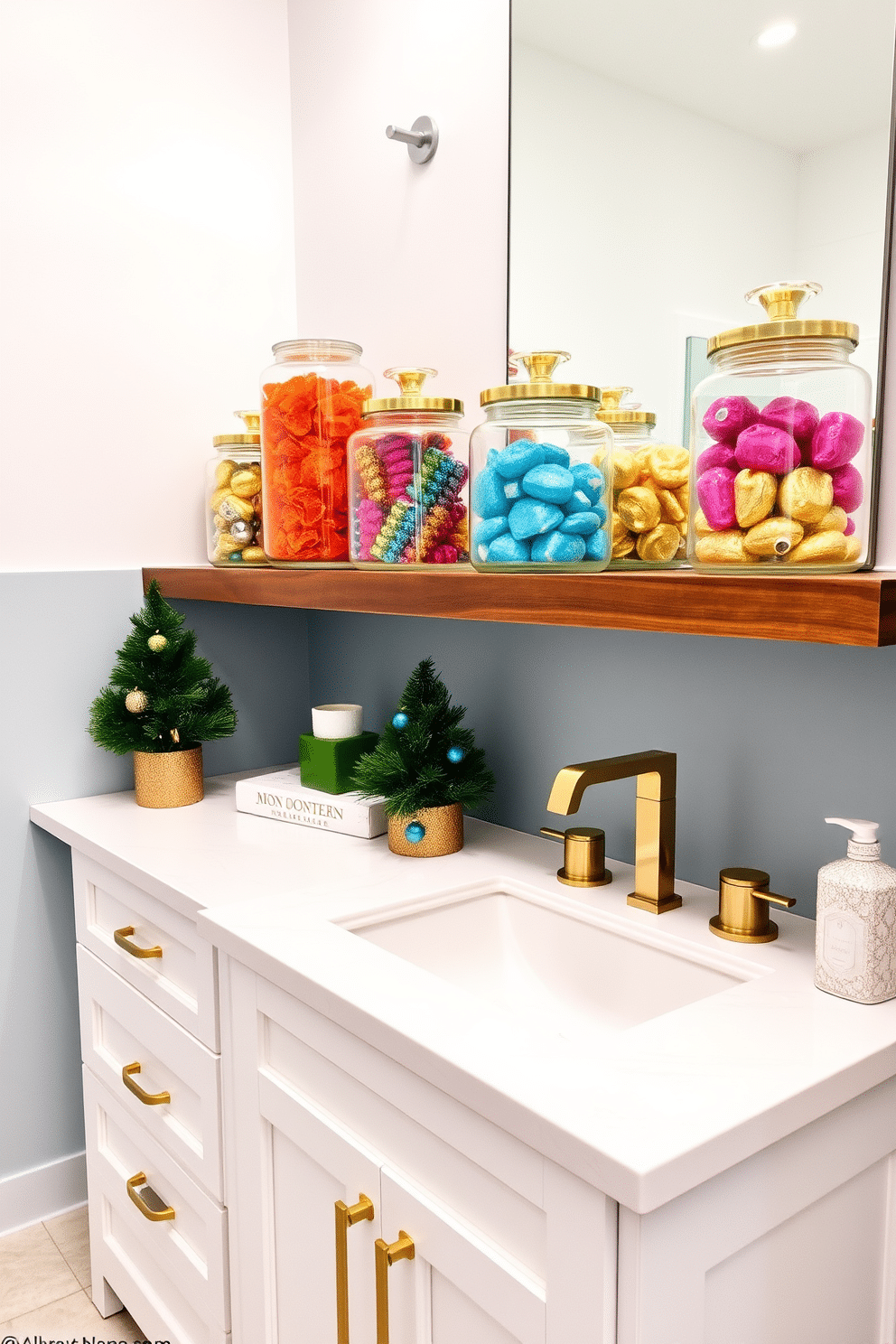 A festive bathroom setting adorned with decorative glass jars filled with colorful gelt. The jars are arranged on a sleek wooden shelf, complemented by a white vanity with gold accents and a subtle blue backsplash.