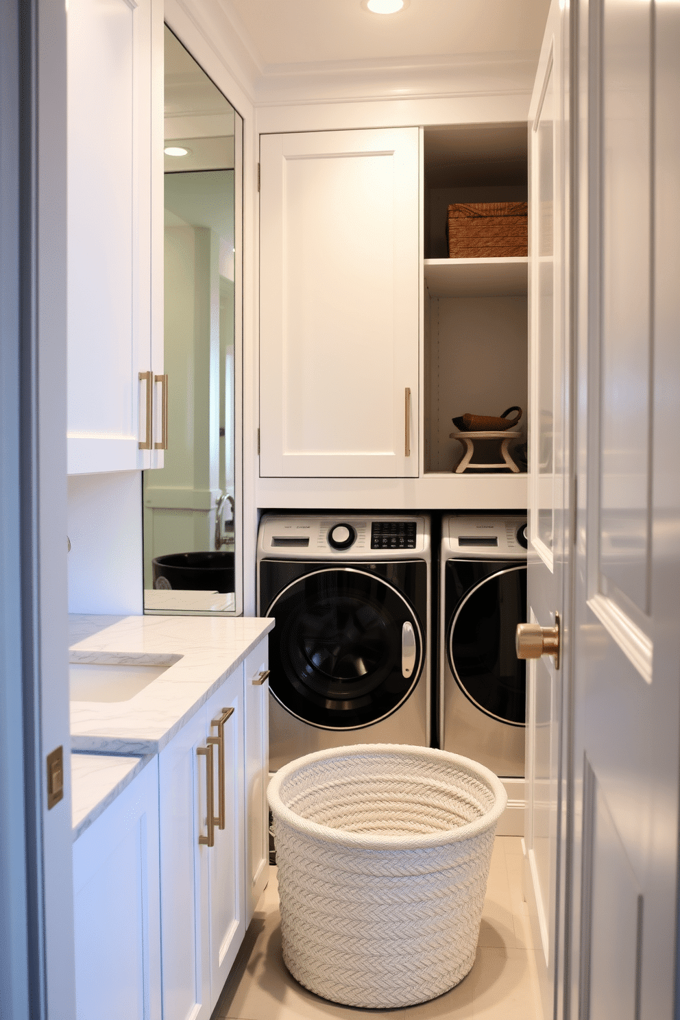 A stylish laundry room that seamlessly integrates with the bathroom. The space features a mirrored cabinet that adds depth and reflects light, enhancing the overall brightness of the room. The cabinetry is a sleek white with brushed gold hardware, and the countertop is a durable quartz with subtle veining. A stacked washer and dryer are tucked away behind the cabinet doors, while a chic laundry basket sits in the corner, adding a touch of elegance.