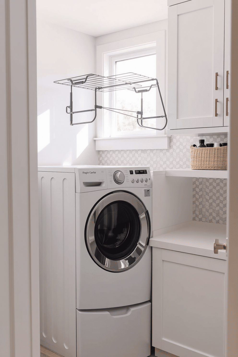 A modern laundry room featuring a sleek washer and dryer combo, with a stylish drying rack mounted above the washer for convenience. The space is brightened by soft, natural light filtering through a window, highlighting the clean lines and organized layout. The walls are painted in a crisp white, complemented by light gray cabinetry that provides ample storage. A textured backsplash in a muted pastel color adds a touch of warmth, while a woven basket sits neatly on a shelf, perfect for storing laundry essentials.