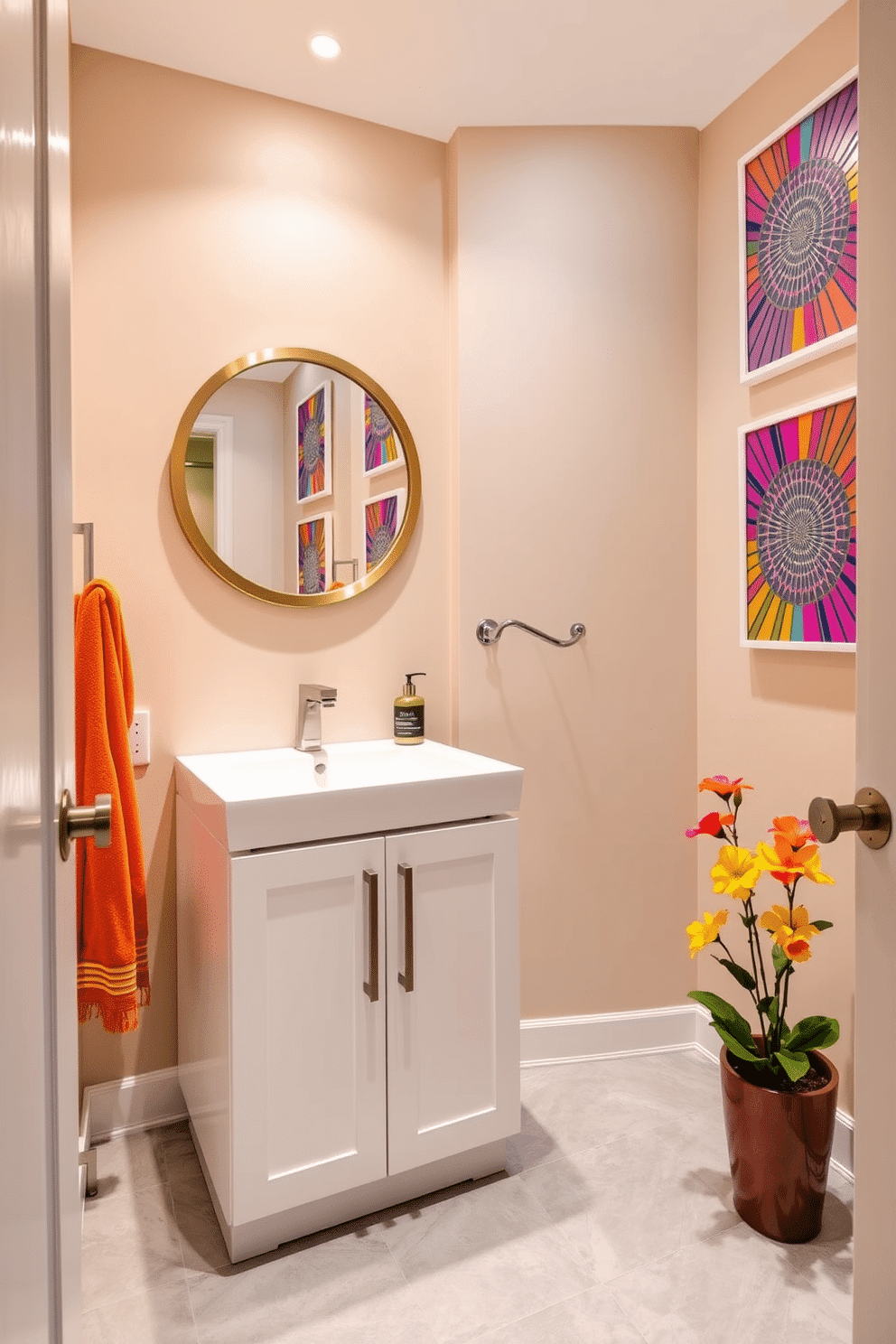 A stylish bathroom powder room featuring neutral tones complemented by vibrant accents. The walls are painted in a soft beige, while colorful artwork in bright hues adds a lively touch. The focal point is a sleek white vanity with a colorful mosaic backsplash that draws the eye. A round mirror framed in brushed gold hangs above the vanity, reflecting the playful colors of the decor. The floor is adorned with light gray tiles, creating a calm base for the lively elements. A bright orange towel and a small potted plant with vivid flowers bring warmth and personality to the space.