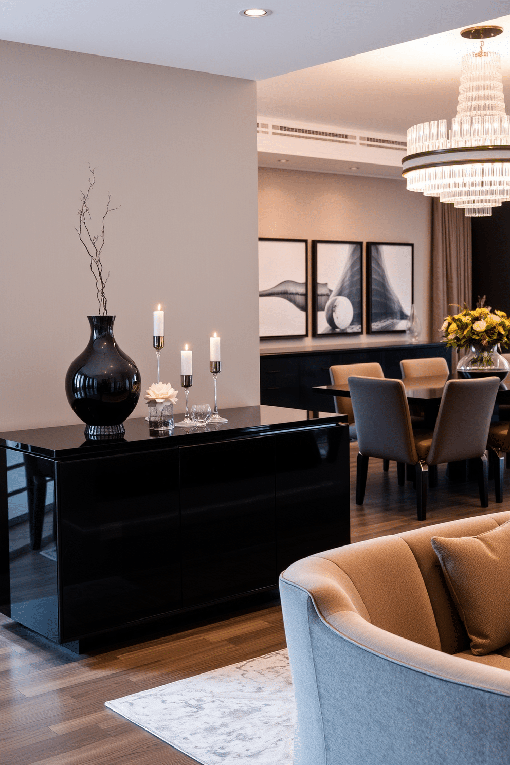 A stylish black sideboard serves as a focal point in an elegant dining room, featuring sleek lines and a glossy finish. The sideboard is adorned with decorative items, such as a sculptural vase and a set of artful candles, enhancing the room's sophisticated ambiance. The dining area is anchored by a large, dark wood table surrounded by plush upholstered chairs in a complementary color. Soft lighting from a modern chandelier casts a warm glow, creating an inviting atmosphere for gatherings and intimate dinners.