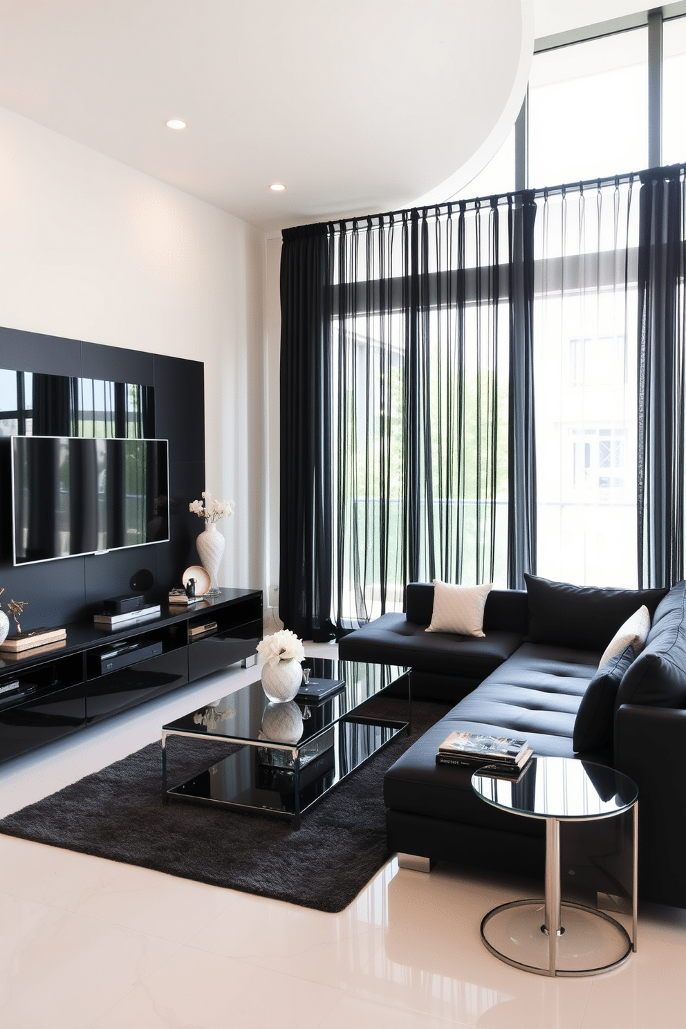 A modern family room featuring sleek black furnishings and glass accents. The space is anchored by a large black sectional sofa, paired with a glass coffee table that reflects light beautifully. On one wall, a black entertainment unit houses a flat-screen TV and stylish decor items. Floor-to-ceiling windows allow natural light to flood the room, complemented by sheer black curtains that add a touch of elegance.