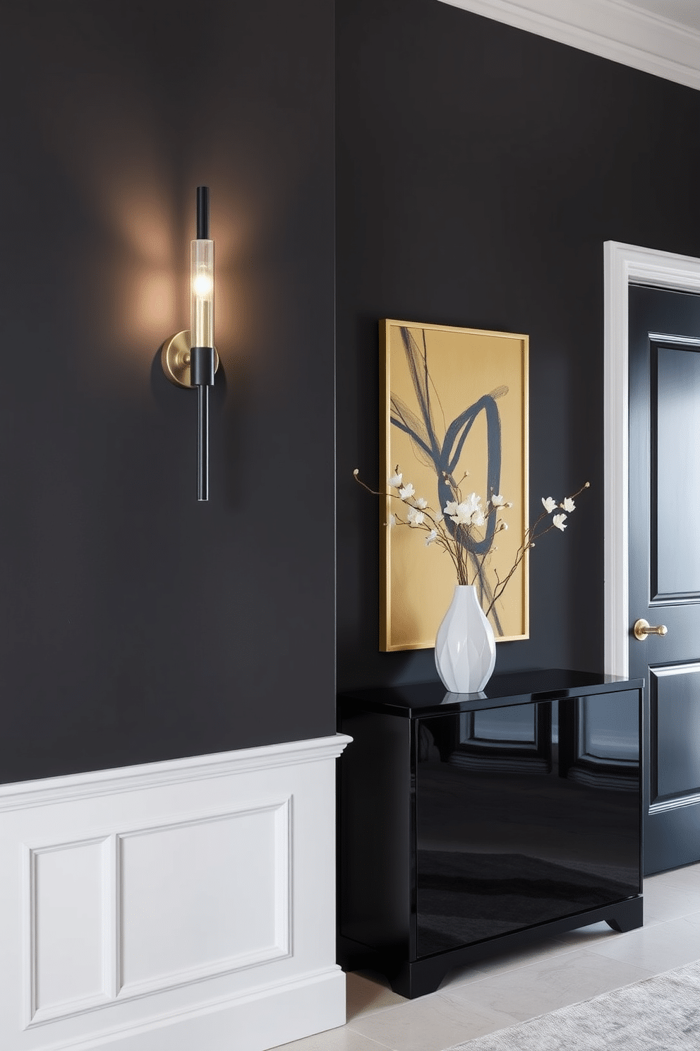 A sophisticated foyer features a striking black and gold wall sconce that illuminates the space with elegance. The walls are painted in a deep charcoal hue, enhancing the luxurious feel, while a sleek console table in black lacquer complements the sophisticated design.