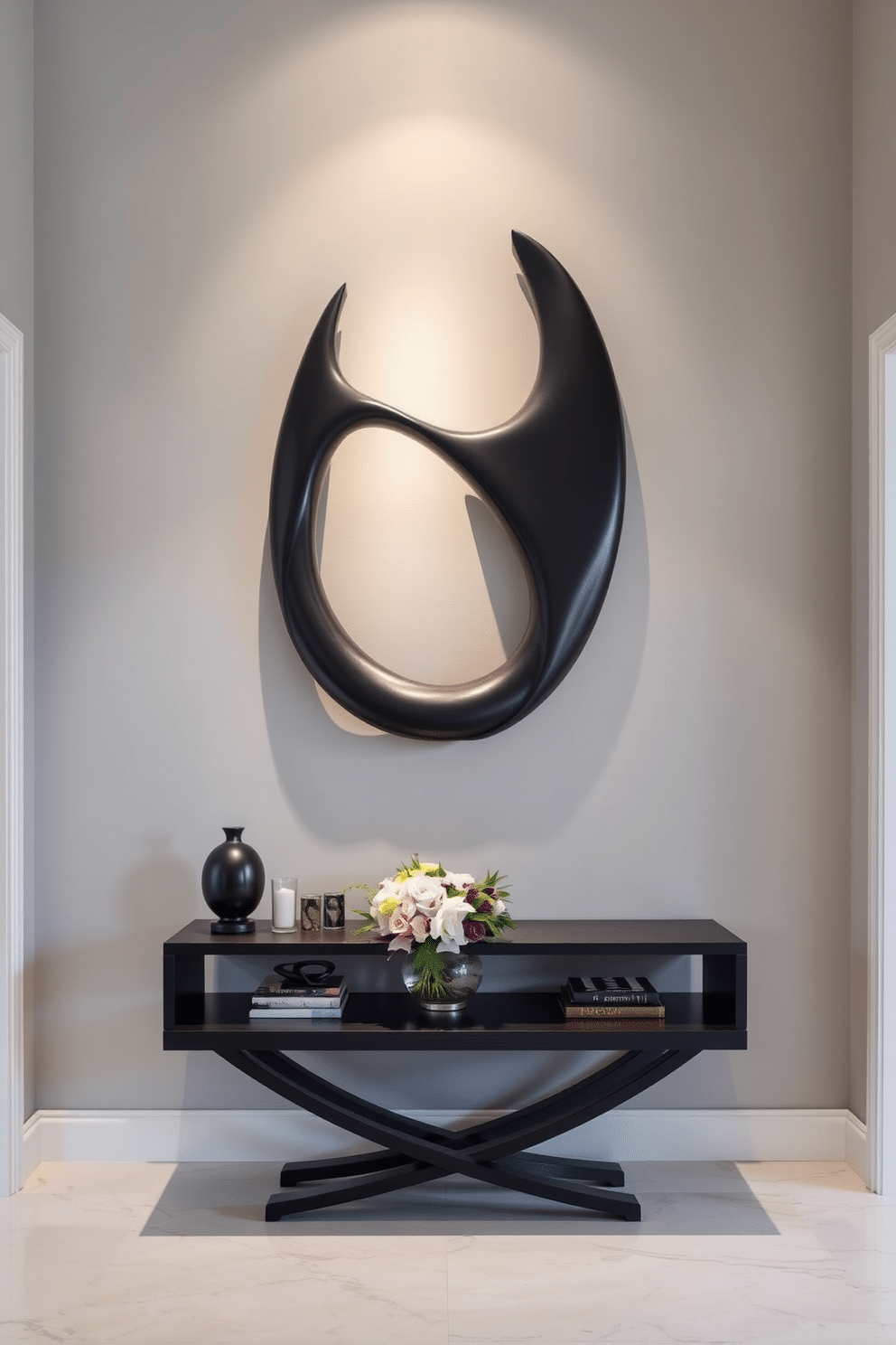 Artistic black sculpture as focal point. The foyer features a striking black sculpture that draws the eye, set against a backdrop of light gray walls. Soft ambient lighting highlights the sculpture's contours, creating a dramatic effect. A sleek console table in front of the sculpture displays decorative objects and a fresh floral arrangement, enhancing the overall elegance of the space.