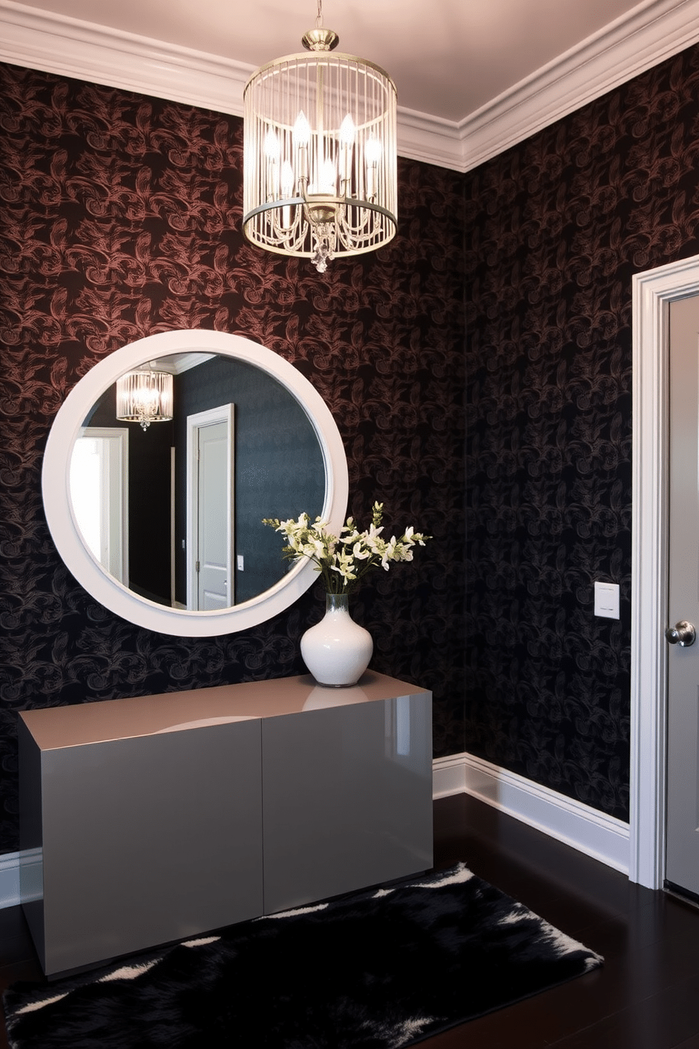 A striking foyer showcases bold black wallpaper adorned with intricate white trim, creating a dramatic entrance. The space features a sleek console table with a glossy finish, complemented by a large round mirror framed in white, reflecting the elegance of the design. A plush area rug in contrasting colors lies beneath, adding warmth to the sophisticated atmosphere. Ambient lighting from a stylish chandelier illuminates the space, highlighting the unique textures and patterns of the wallpaper.