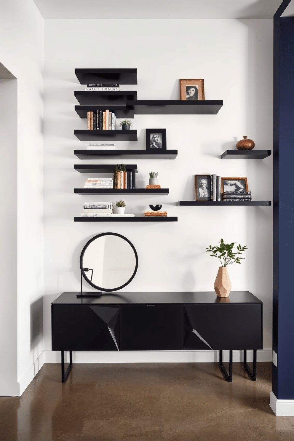 Sleek black floating shelves line the wall in a modern foyer, showcasing an array of curated decor items, including books, plants, and art pieces. The space features a minimalist aesthetic with a polished concrete floor and soft ambient lighting that highlights the shelves' clean lines. The foyer is framed by a bold accent wall painted in deep navy blue, creating a striking contrast against the black shelves. A stylish console table with geometric design elements sits beneath the shelves, adorned with a decorative mirror and a unique sculpture.