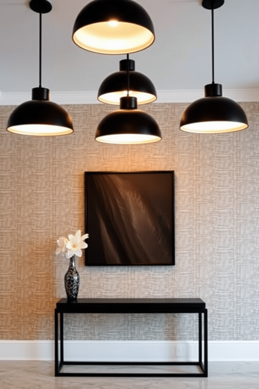 A striking foyer featuring modern black pendant lights that provide warm illumination. The space is adorned with a sleek console table against a backdrop of textured wallpaper, creating a sophisticated entrance.