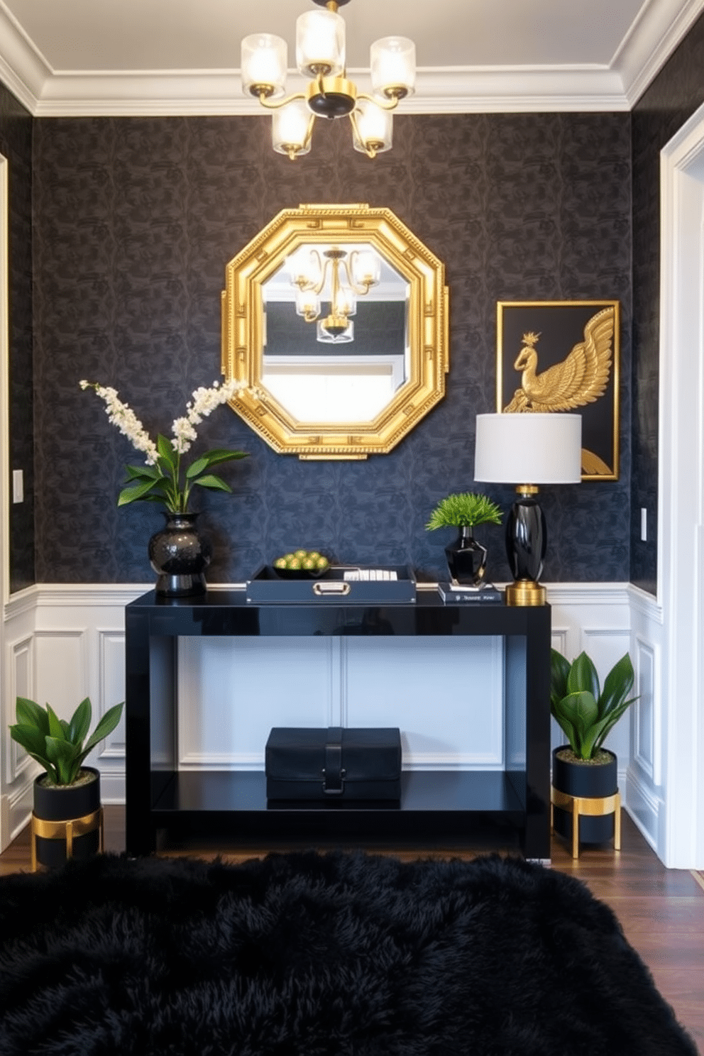 A stylish foyer featuring a sleek black console table with gold accents, topped with a decorative black and gold tray for organization. The walls are adorned with elegant black wallpaper, and a striking gold-framed mirror hangs above the table, reflecting the ambient lighting from a chic chandelier. On the floor, a plush black area rug adds warmth and texture, while a statement piece of art in gold tones complements the overall design. Potted plants in decorative black and gold planters provide a touch of greenery, enhancing the sophisticated atmosphere of the space.