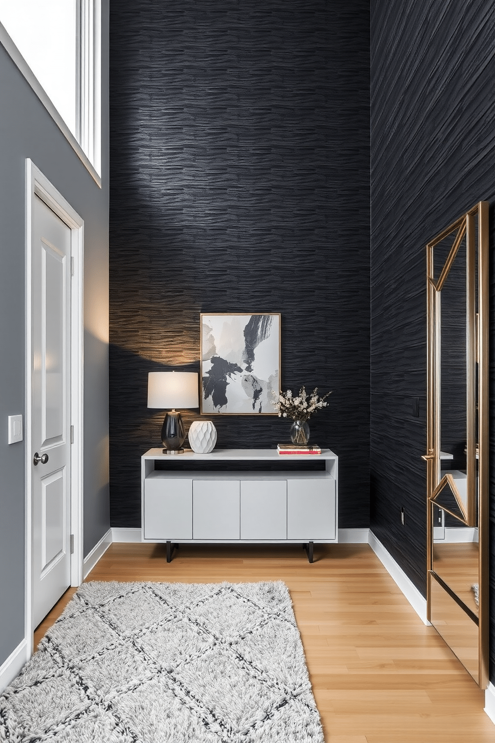 Textured black wall panels create a striking focal point in a modern foyer, adding depth and sophistication to the space. The entrance features a sleek console table with a minimalist design, complemented by a stylish lamp and an abstract piece of art above it. The flooring is a light wood, contrasting beautifully with the dark walls, while a plush area rug adds warmth and comfort underfoot. A large mirror with a geometric frame reflects the light, enhancing the foyer's spacious feel and inviting guests into the home.