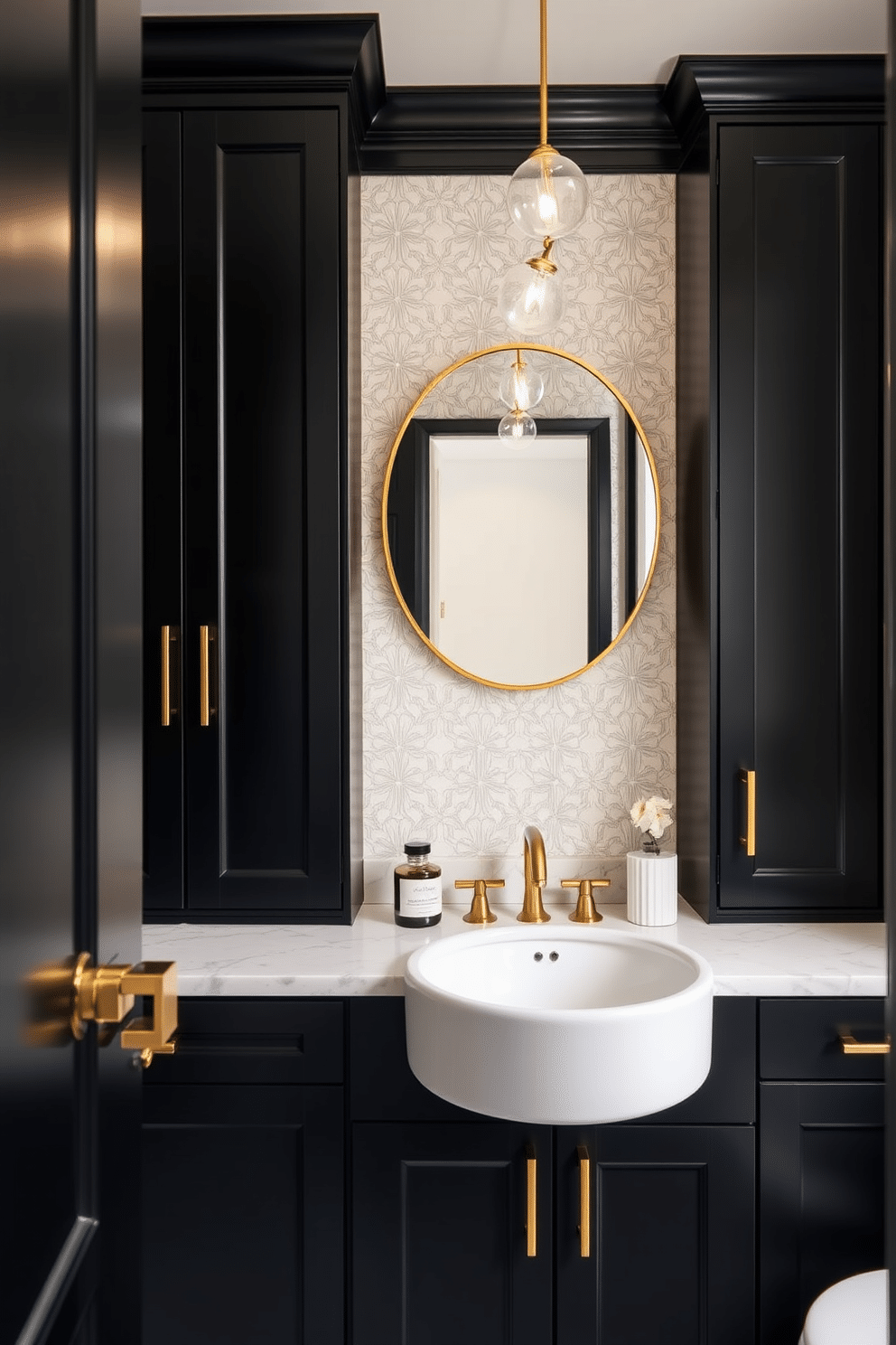 Chic black cabinetry with stylish hardware creates a striking focal point in this elegant powder room. The cabinetry features sleek lines and polished gold handles, complementing the overall sophisticated aesthetic. The walls are adorned with a soft, neutral wallpaper that enhances the richness of the black cabinetry. A round mirror with a thin gold frame hangs above the stylish sink, reflecting the ambient lighting from a modern chandelier overhead.