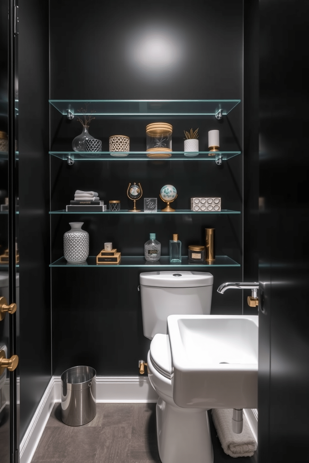 A striking black powder room features sleek glass shelves mounted against the bold black walls, showcasing an array of curated decor items. The space is illuminated by elegant sconces that cast a warm glow, enhancing the dramatic contrast of the dark surroundings.