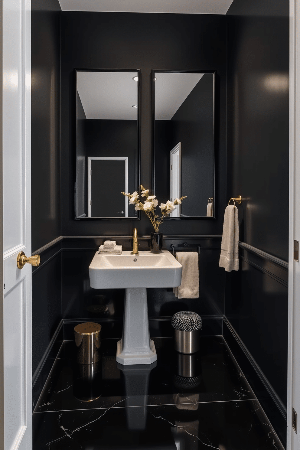 A chic black powder room features sleek black-framed mirrors that enhance the modern aesthetic. The walls are adorned with a deep charcoal paint, while a stylish pedestal sink adds elegance to the space. The floor is covered in glossy black tiles that reflect light beautifully, creating a sense of depth. Accents of gold in the fixtures and accessories add a touch of luxury to the overall design.