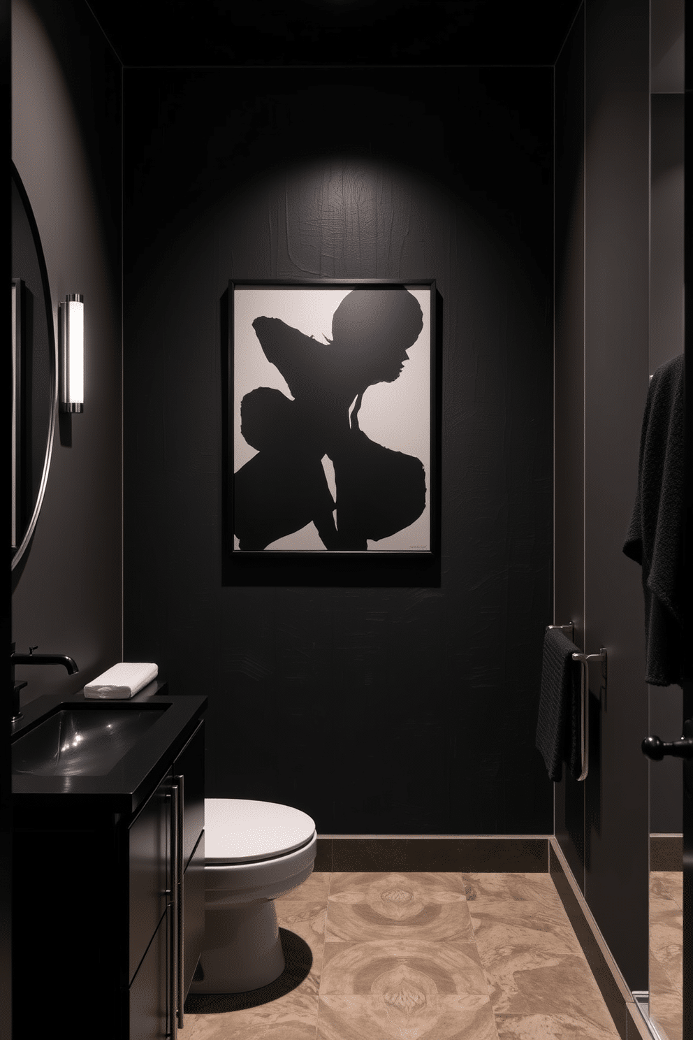 A contemporary black powder room features striking black artwork as the focal point, elegantly displayed on a textured accent wall. The room is adorned with sleek fixtures, including a minimalist black vanity and a chic wall-mounted sink, creating a sophisticated ambiance.