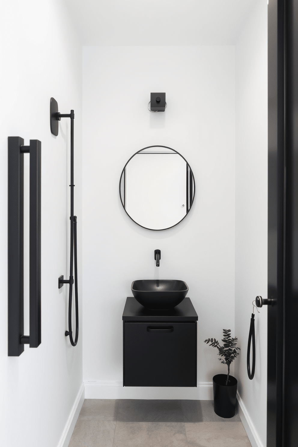 A sleek black powder room featuring minimalist accessories that enhance the streamlined aesthetic. The walls are painted in a soft white, creating a striking contrast with the matte black fixtures and accessories. A wall-mounted sink with a geometric shape sits above a compact black vanity, complemented by a simple black mirror with clean lines. The floor is adorned with light gray tiles, and a small potted plant adds a touch of greenery to the monochromatic design.