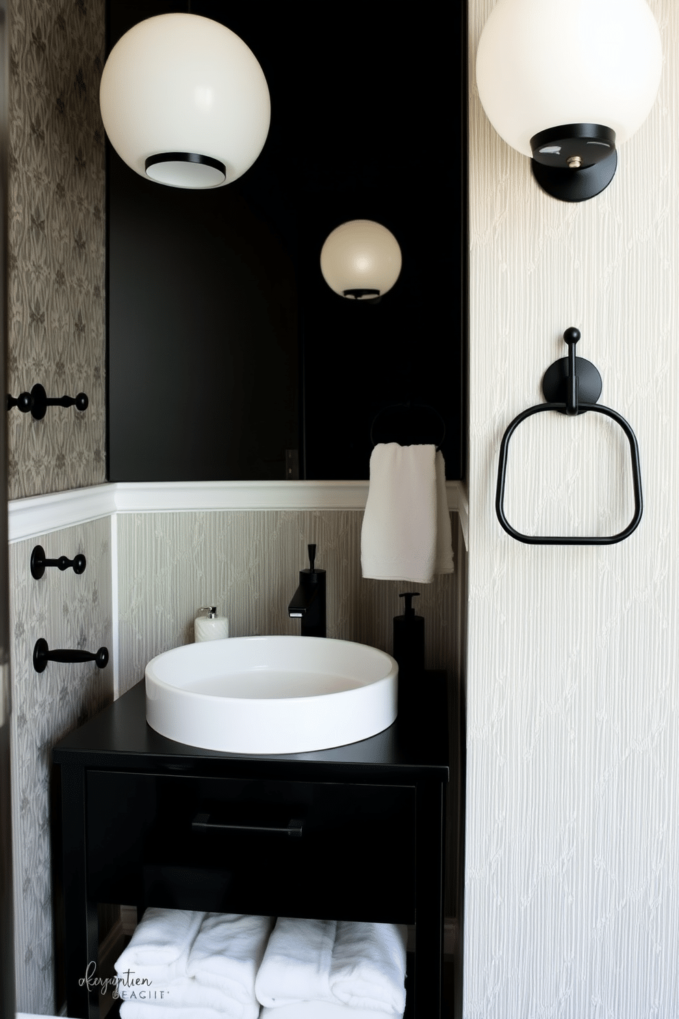 A chic black powder room features stylish black towel racks and hooks, seamlessly integrated into the design. The walls are adorned with elegant wallpaper in a subtle pattern, while a sleek black vanity with a white sink adds sophistication to the space.