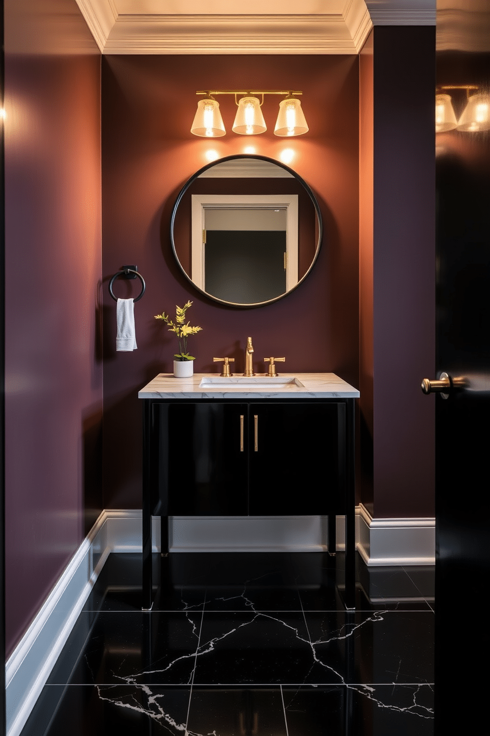 A sleek black vanity with a polished marble top sits against the wall, creating a striking contrast in the powder room. Above the vanity, a round mirror with a thin black frame reflects the elegant lighting fixtures that add a warm glow to the space. The walls are adorned with a rich, deep hue that complements the vanity, while the floor features glossy black tiles for a cohesive look. Accents of gold in the faucet and accessories bring a touch of luxury, and a small potted plant adds a hint of freshness to the design.