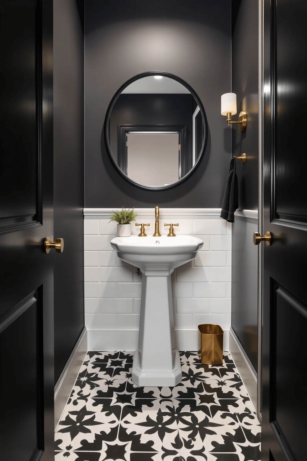 A stylish powder room featuring black and white geometric patterned tiles that create a striking visual contrast on the floor. The walls are painted in a soft matte black, enhancing the room's elegant ambiance while a sleek white pedestal sink adds a modern touch. A round mirror with a black frame hangs above the sink, reflecting the intricate tile design below. Brass fixtures and accessories provide a warm accent, while a small potted plant adds a touch of greenery to the sophisticated space.