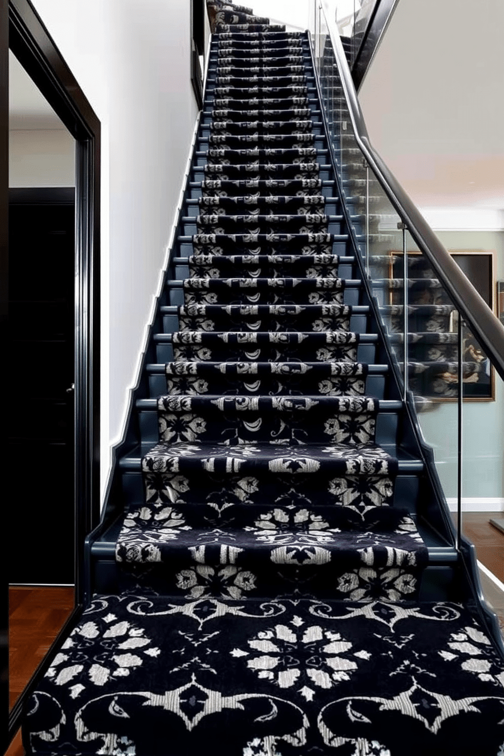 A bold black staircase features a striking patterned carpet that adds a touch of elegance and visual interest. The staircase is flanked by modern glass railings, creating a seamless blend of contemporary design and classic charm.