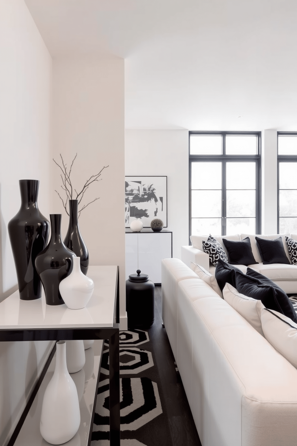 A striking arrangement of black and white decorative vases sits on a sleek, modern console table. The vases vary in height and shape, creating a dynamic visual interest against a backdrop of soft, neutral walls. The basement features a bold black and white design, with a geometric patterned rug anchoring the space. Plush white sofas are accented by black throw pillows, and large windows allow natural light to illuminate the stylish decor.