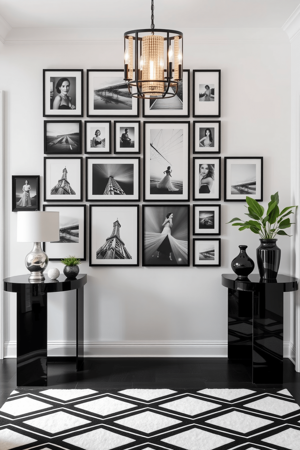 A striking black and white photo gallery wall display features a curated collection of framed monochrome images in various sizes, arranged in a dynamic grid pattern. The frames are a mix of sleek black and elegant white finishes, adding depth and contrast to the wall. The foyer showcases a sophisticated black and white design, with a bold geometric patterned rug anchoring the space. Flanking the entrance, tall, slim console tables in glossy black hold decorative items and fresh greenery, while a statement light fixture illuminates the area with a warm glow.