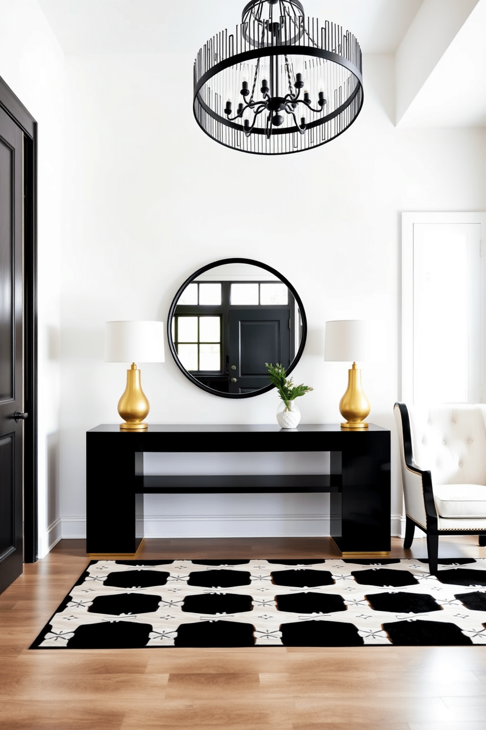 A striking foyer featuring a bold contrast of furniture pieces. On one side, a sleek black console table with gold accents stands against a bright white wall, while a plush white armchair with black trim is positioned nearby. The floor is adorned with a large black and white geometric rug that ties the space together. Above the console, a large round mirror with a black frame reflects the light from a chic chandelier hanging overhead.