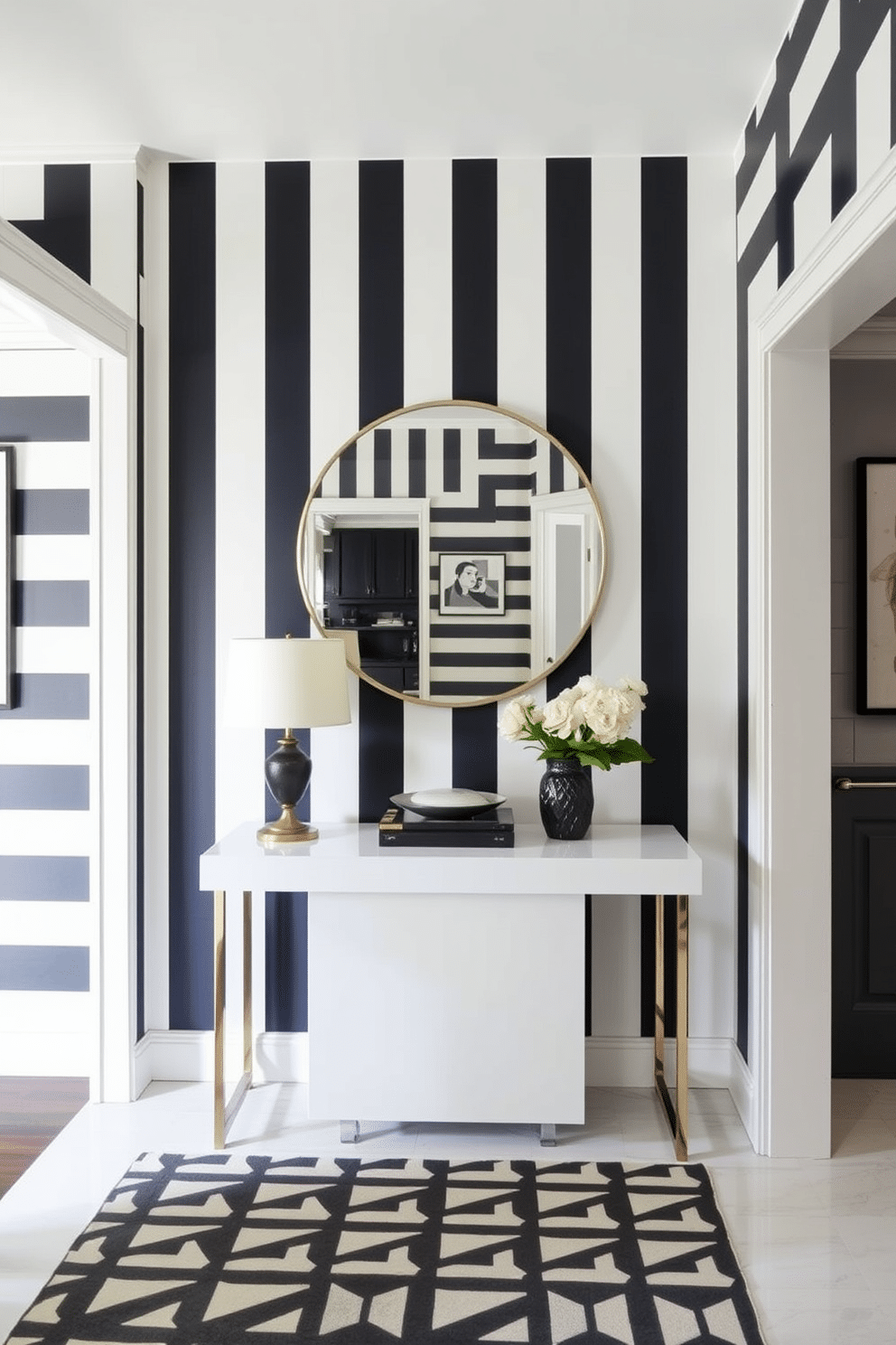 Chic striped wallpaper creates a bold statement in the foyer, with alternating wide and narrow stripes in shades of deep navy and crisp white. The design adds depth and sophistication, making the space feel both stylish and inviting. The black and white foyer features a sleek console table with a glossy finish, topped with a large round mirror that reflects the striking wallpaper. A geometric patterned rug anchors the space, while minimalist artwork adorns the walls, enhancing the contemporary aesthetic.