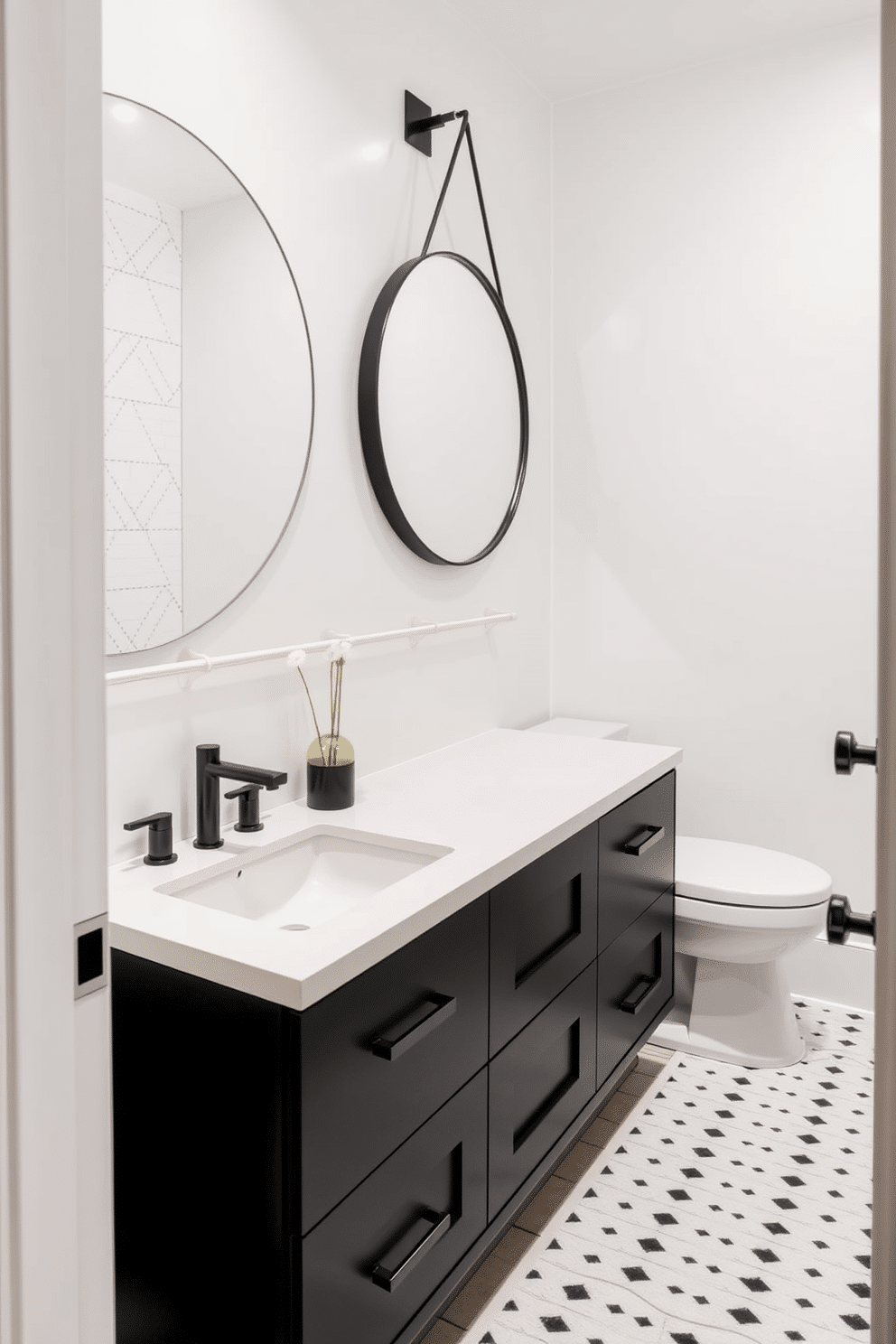 A sleek black cabinetry design features a smooth white countertop that creates a striking contrast. The powder room is accented with elegant fixtures and minimalist decor, enhancing the modern aesthetic. The walls are adorned with a subtle geometric pattern in black and white, adding visual interest without overwhelming the space. A round mirror with a thin black frame hangs above the sink, reflecting the stylish ambiance of the room.