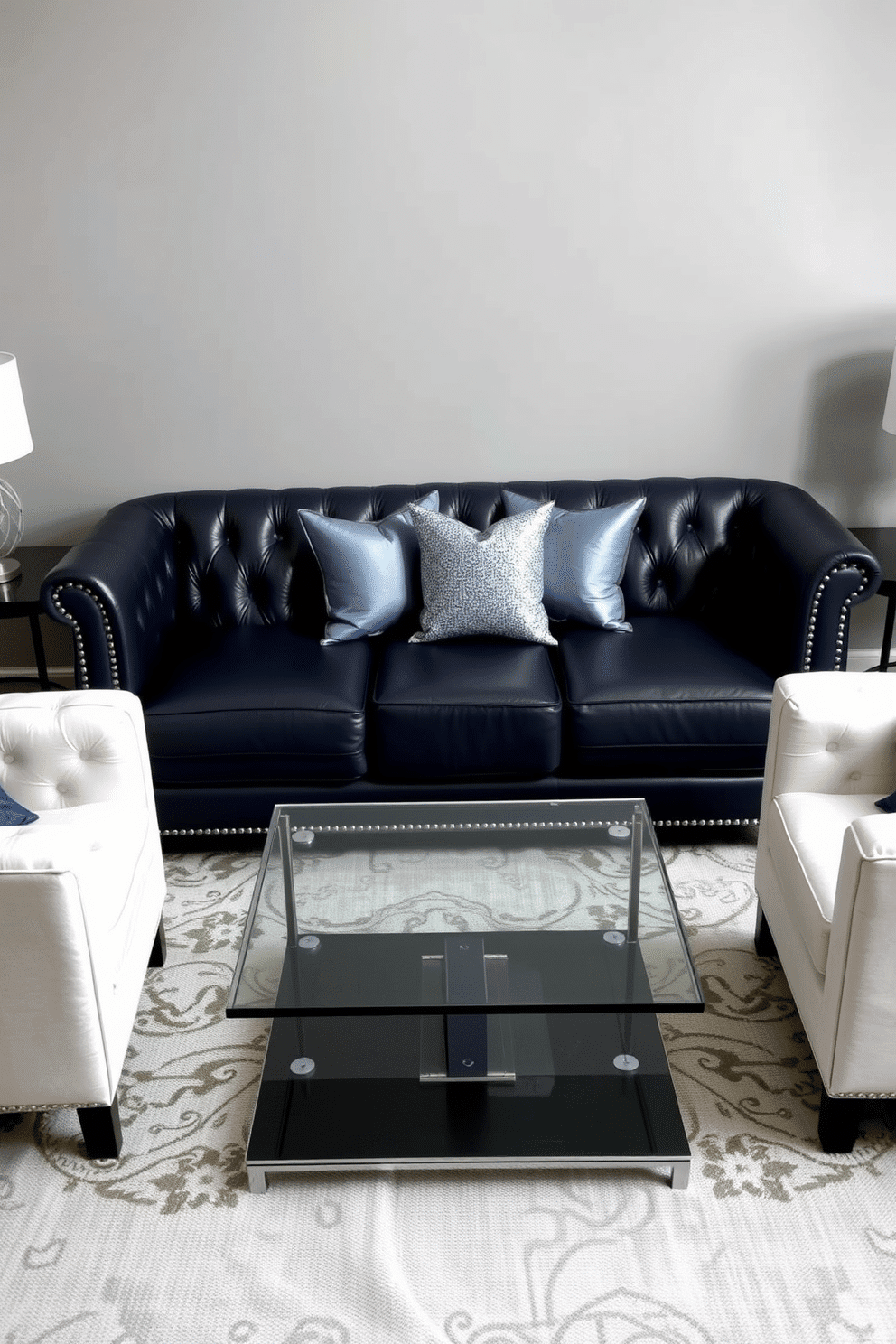 A cozy family room featuring a dark blue leather sofa adorned with silver accents, providing a modern yet inviting atmosphere. The walls are painted in a soft gray, complementing the rich tones of the furniture and enhancing the overall elegance of the space. A sleek glass coffee table sits in front of the sofa, flanked by plush white armchairs that add contrast and comfort. Decorative throw pillows in various shades of blue and silver are scattered across the sofa, adding a touch of personality to the room.