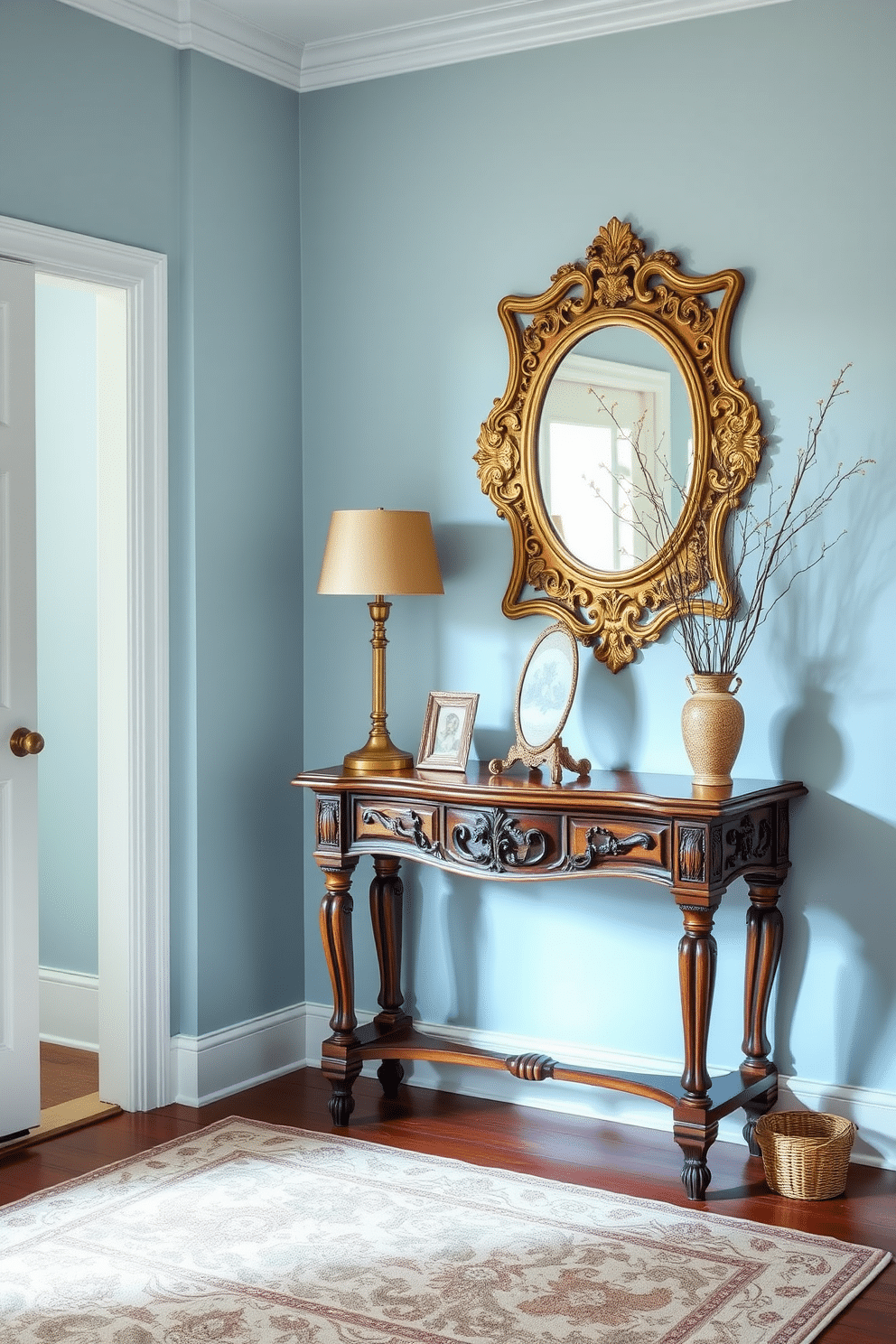 A serene powder blue foyer adorned with vintage accessories creates an inviting atmosphere. The walls are painted in a soft powder blue, complemented by a classic wooden console table featuring ornate carvings. On the console, a collection of vintage items, including a brass lamp and an antique mirror, adds character and charm. A patterned area rug in muted tones anchors the space, while a small potted plant brings a touch of greenery to the design.