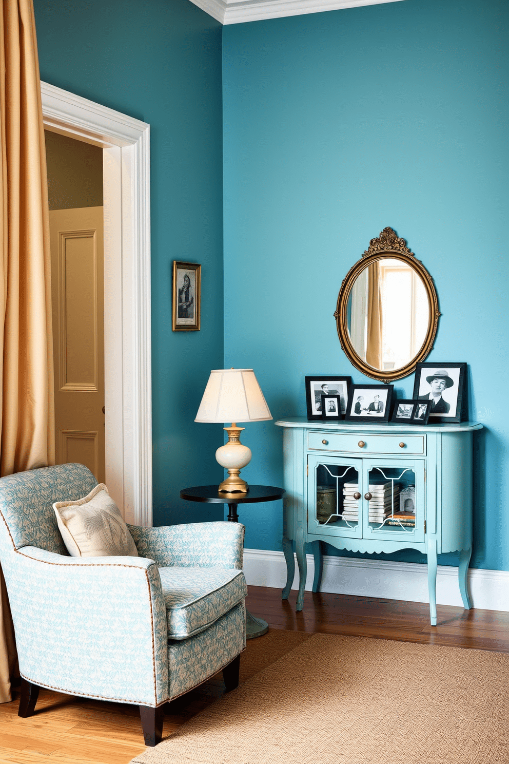 A vintage blue foyer setting that exudes charm and nostalgia. The space features retro furnishings, including a plush, patterned armchair and a small round table topped with a vintage lamp. The walls are painted in a soft vintage blue, creating a serene backdrop. A classic console table stands against one wall, adorned with framed black-and-white photographs and a decorative mirror above it.