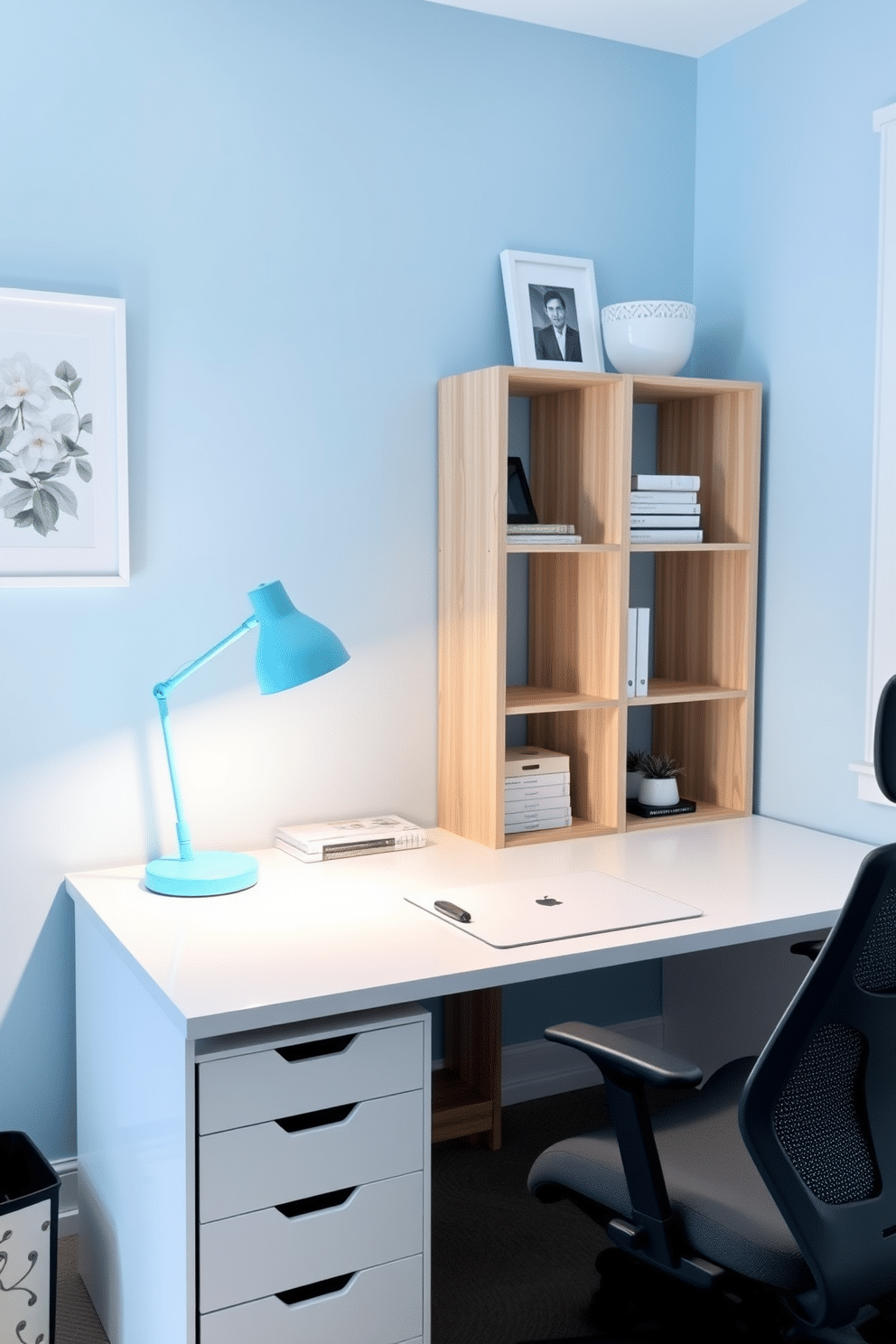 A modern home office featuring a sleek white desk illuminated by an aqua desk lamp. The walls are painted in a calming light blue, and the space is accented with minimalistic decor and a comfortable ergonomic chair.