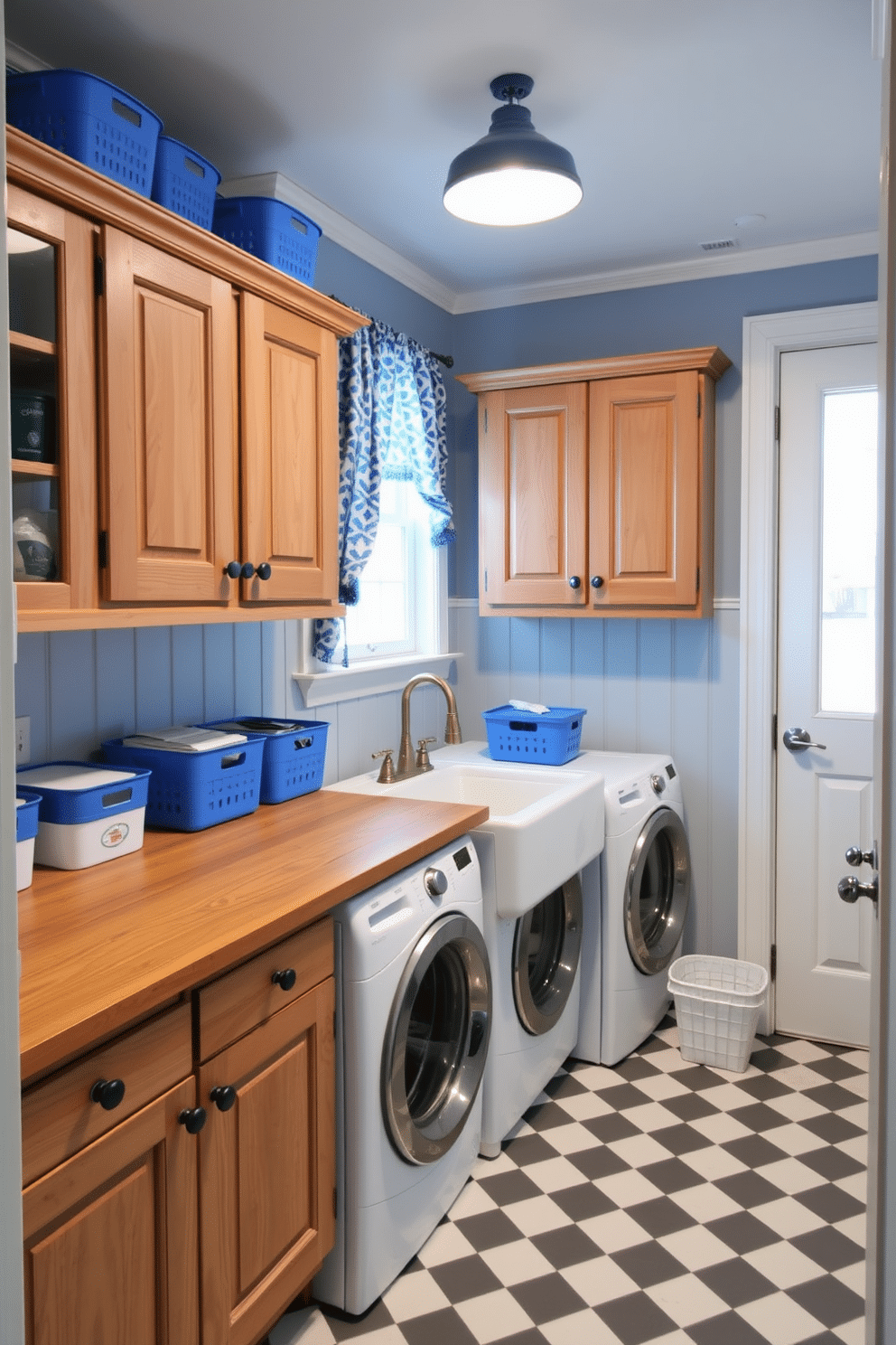 A charming vintage farmhouse laundry room featuring blue decor. The space includes rustic wooden cabinets with a distressed finish, complemented by a farmhouse sink with a vintage-style faucet. Bright blue accents are incorporated through patterned curtains and decorative storage bins. The floor is covered with a checkered tile, and a wooden countertop provides ample space for folding laundry.