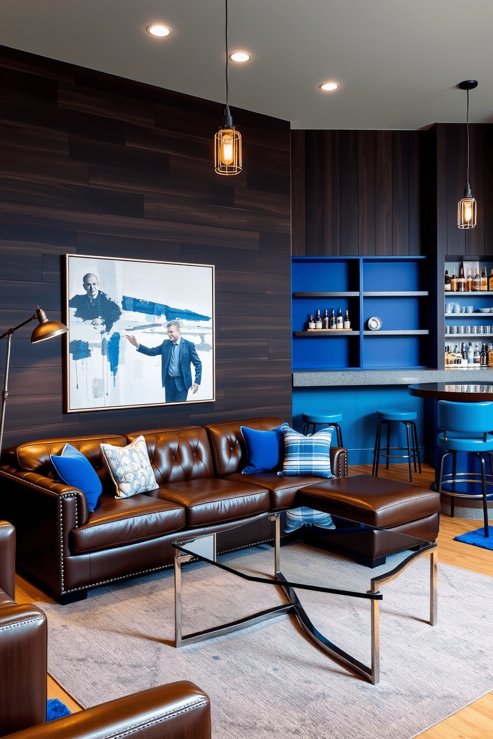 Accent wall with dark wood paneling, creating a warm and inviting atmosphere. The room features a plush leather sofa and a sleek glass coffee table, complemented by industrial-style lighting fixtures. Bold blue accents throughout the space add a modern touch, with a large abstract painting serving as a focal point. A stylish bar area with high stools and shelves stocked with spirits enhances the man cave vibe.