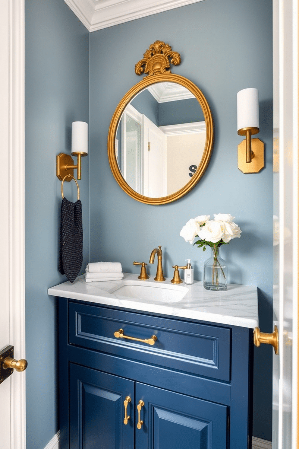 A stunning powder room featuring a navy blue custom vanity adorned with elegant gold accents. The walls are painted a soft powder blue, creating a serene backdrop that complements the rich tones of the vanity. The vanity is topped with a pristine white marble countertop, enhancing the luxurious feel of the space. A stylish round mirror with a gold frame hangs above the vanity, reflecting the chic decor and adding depth to the room.