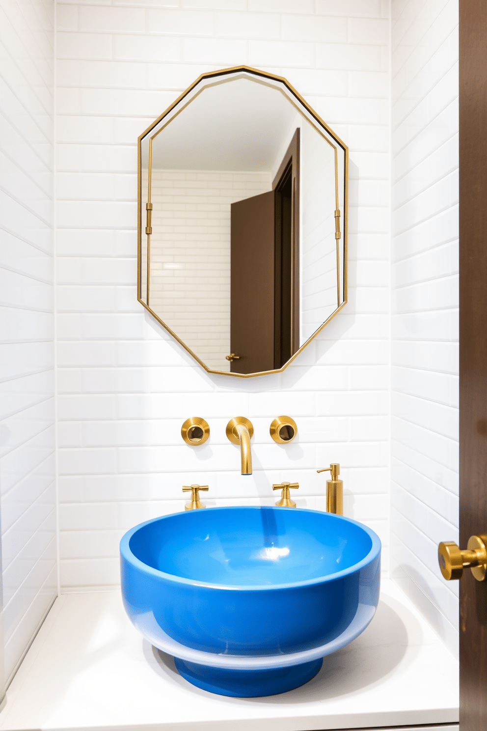 A sleek blue sink with a contemporary design is the focal point of this modern powder room. The walls are adorned with crisp white tiles, creating a fresh and airy atmosphere that complements the bold color of the sink. The countertop features elegant brass fixtures that add a touch of luxury to the space. A minimalist mirror with a geometric frame hangs above the sink, reflecting the stylish decor and enhancing the room's overall aesthetic.