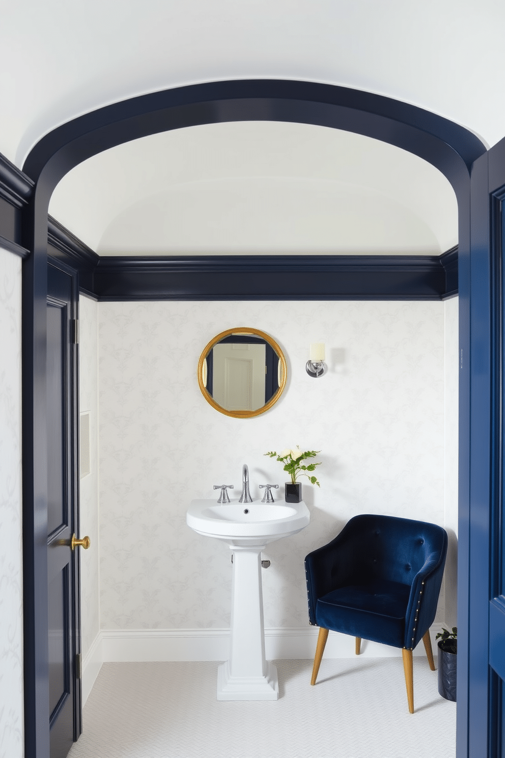 Crown molding painted in navy blue frames the ceiling of a chic powder room, adding a touch of elegance to the space. The walls are adorned with a soft white wallpaper featuring delicate patterns, enhancing the room's sophistication. A sleek pedestal sink with a polished chrome faucet sits against one wall, complemented by a small round mirror with a gold frame above it. To the side, a stylish navy blue accent chair invites guests to relax, while a small potted plant adds a pop of greenery to the decor.